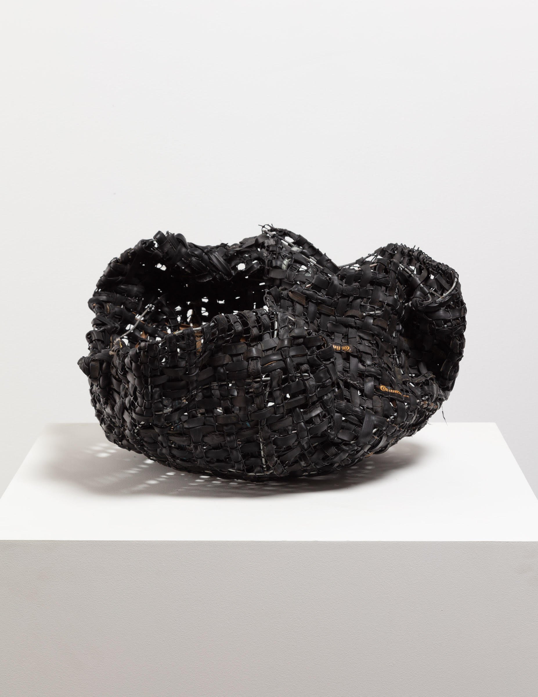  Woven Basket, 2022  Bicycle tires and inner tubes, rubber, metal, plastic  12 x 20 x 16 inches 