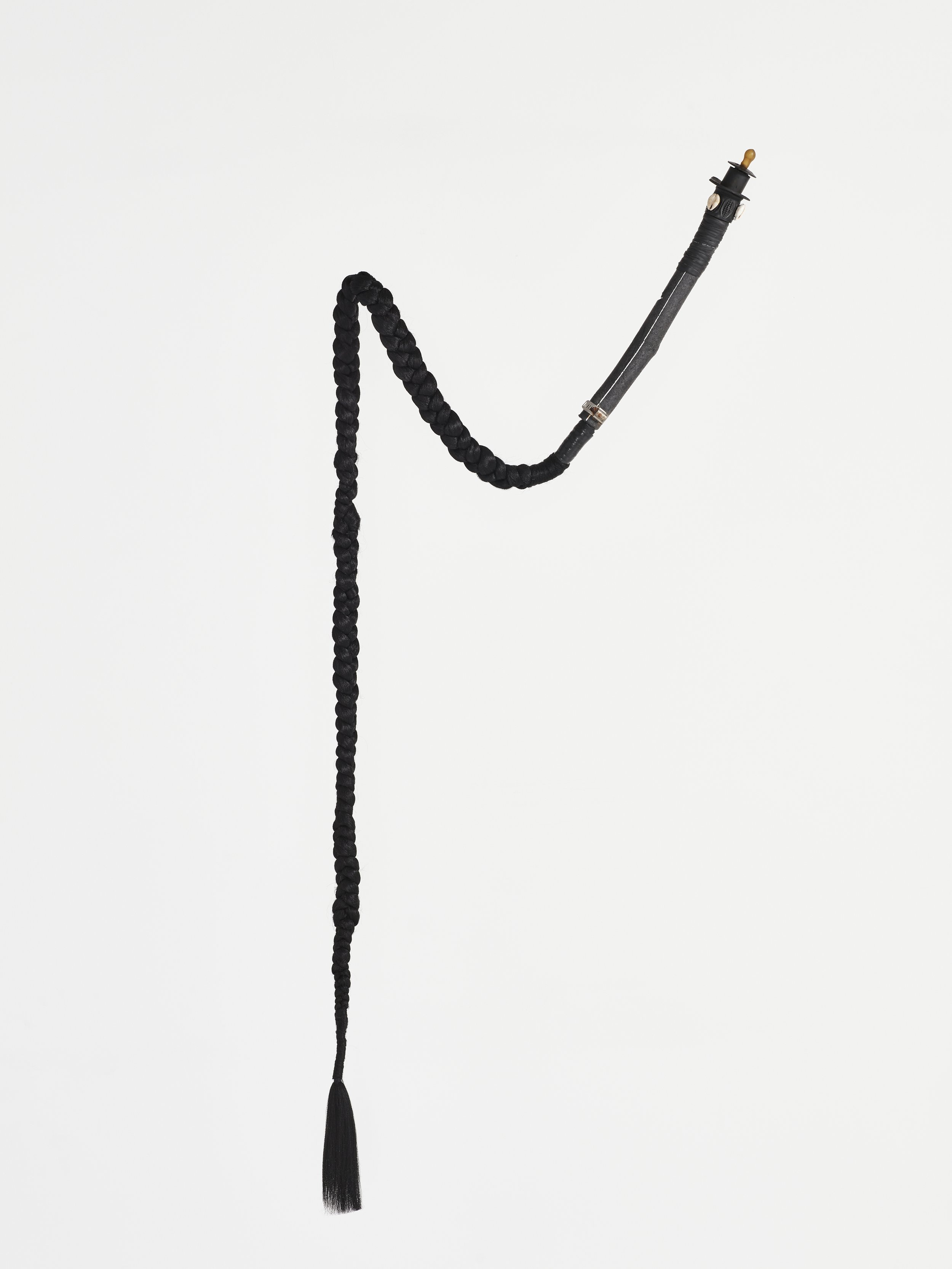 Irukere for Màmá (To nurture with discipline), 2020 Màmá ran a tight ship A long umbilical braid Passing through lineage It nurtured As it cracked Found objects, pacifier, cowrie shells, synthetic hair fibre 87.75 × 3.75 × 3 inches