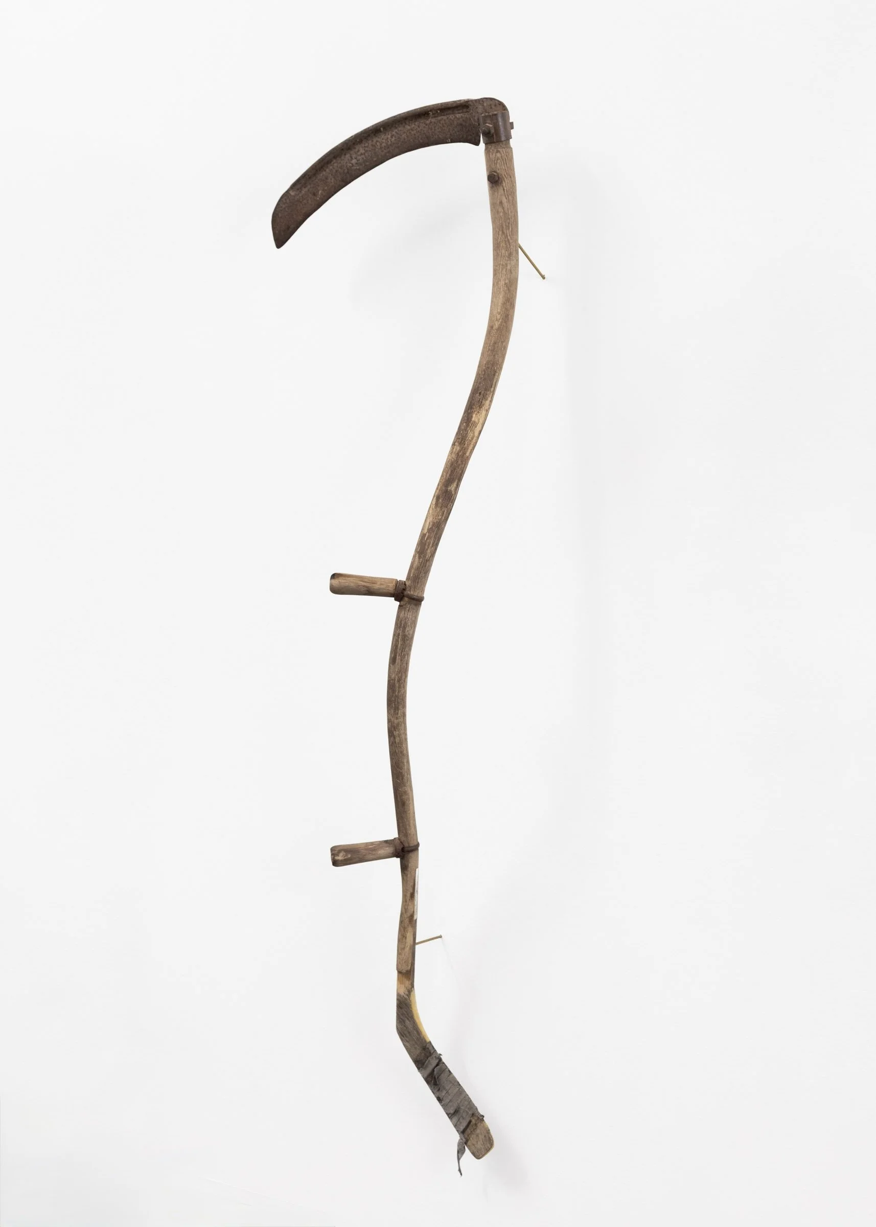  Ploughing Liberty #27, 2026  Antique scythe, found hockey stick, brass dowel   68 × 20 inches 