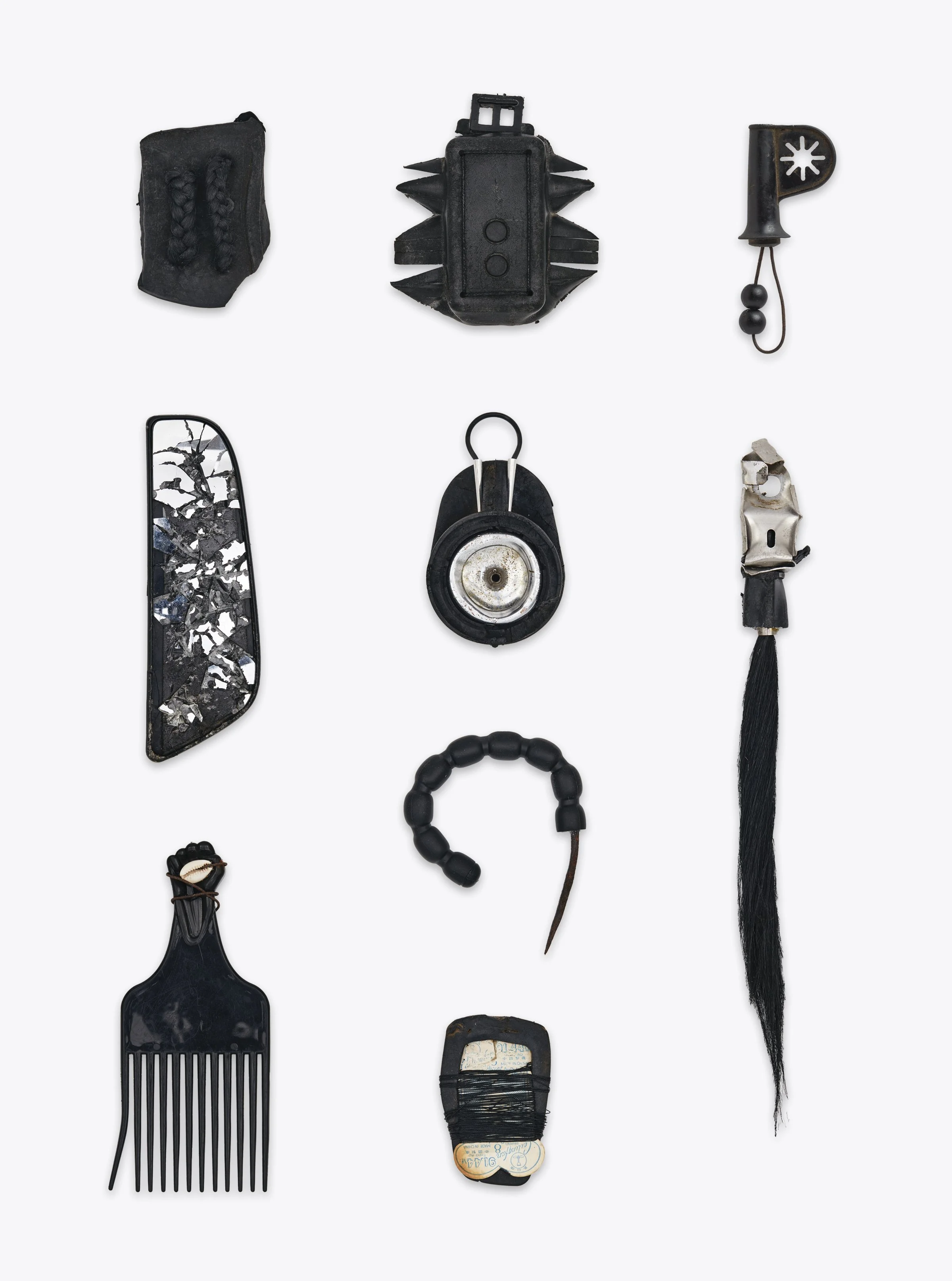  Eminado Reunion 14, (2023)  Rubber, leather, synthetic hair fibre, found objects, cowrie shells  Vairable dimensions 