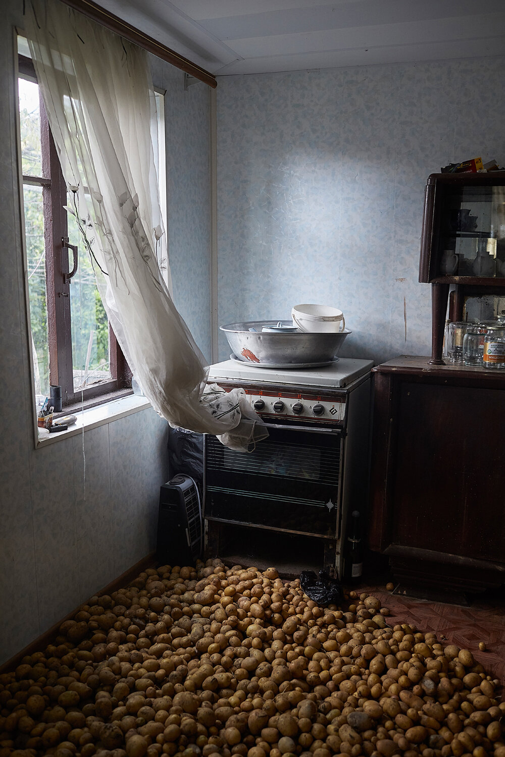  Abkhazia, Eshera, 07/07/2017. Potatoes are stored on a floor in order for them to stay dry. 