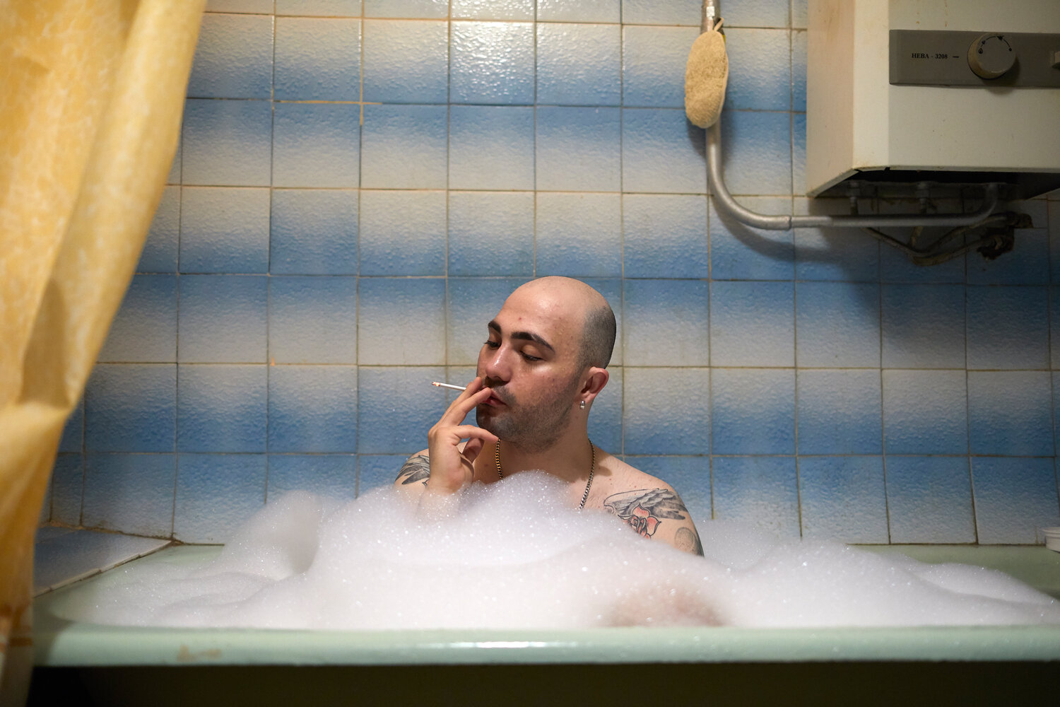  Russia, Moscow, 14/04/2019. Konstantin Prima (28) in his bath tub. He is openly gay. He earns his money by performing as a famous Russian singer Alla Pugacheva.  