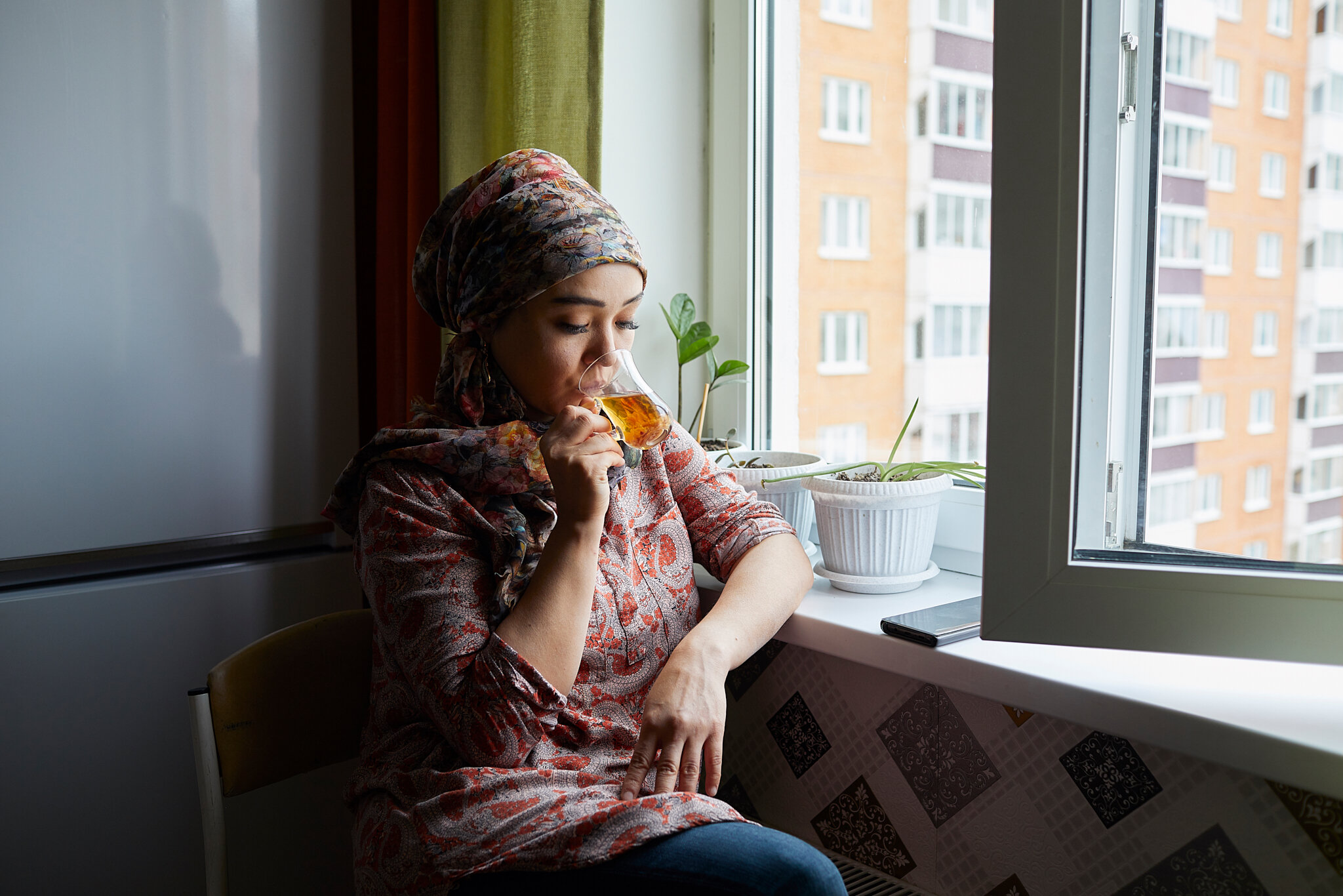 Russia, Domodedovo, 07/10/2019. Venera Bokotaeva from Kyrgyzstan in her own flat in Domodedovo, Moscow Oblast, Russia. Venera runs a support organization for Kyrgyz women called Bakyt (Kyrgyz for “happiness”). Venera, who has degrees in law and inte