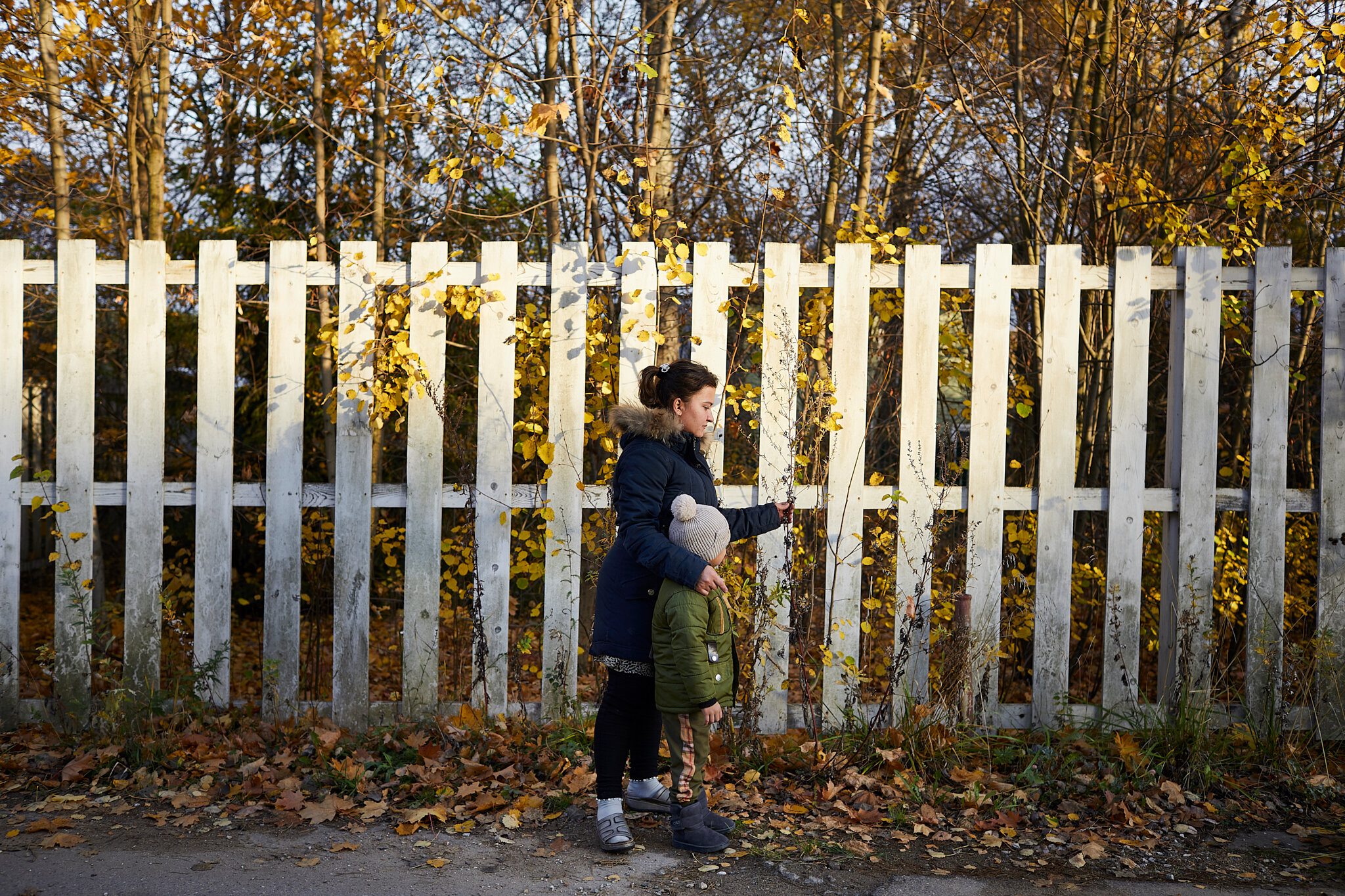 Russia, Moscow oblast, Odintsovo city district, Perhushkovo village, 05/10/2019. Zarina U.,19, with Elnur Zarinov, 5, on a walk. Zarina is from Qashqadaryo region in Uzbekistan and works as a babysitter. She takes care of brothers Elyor in a village