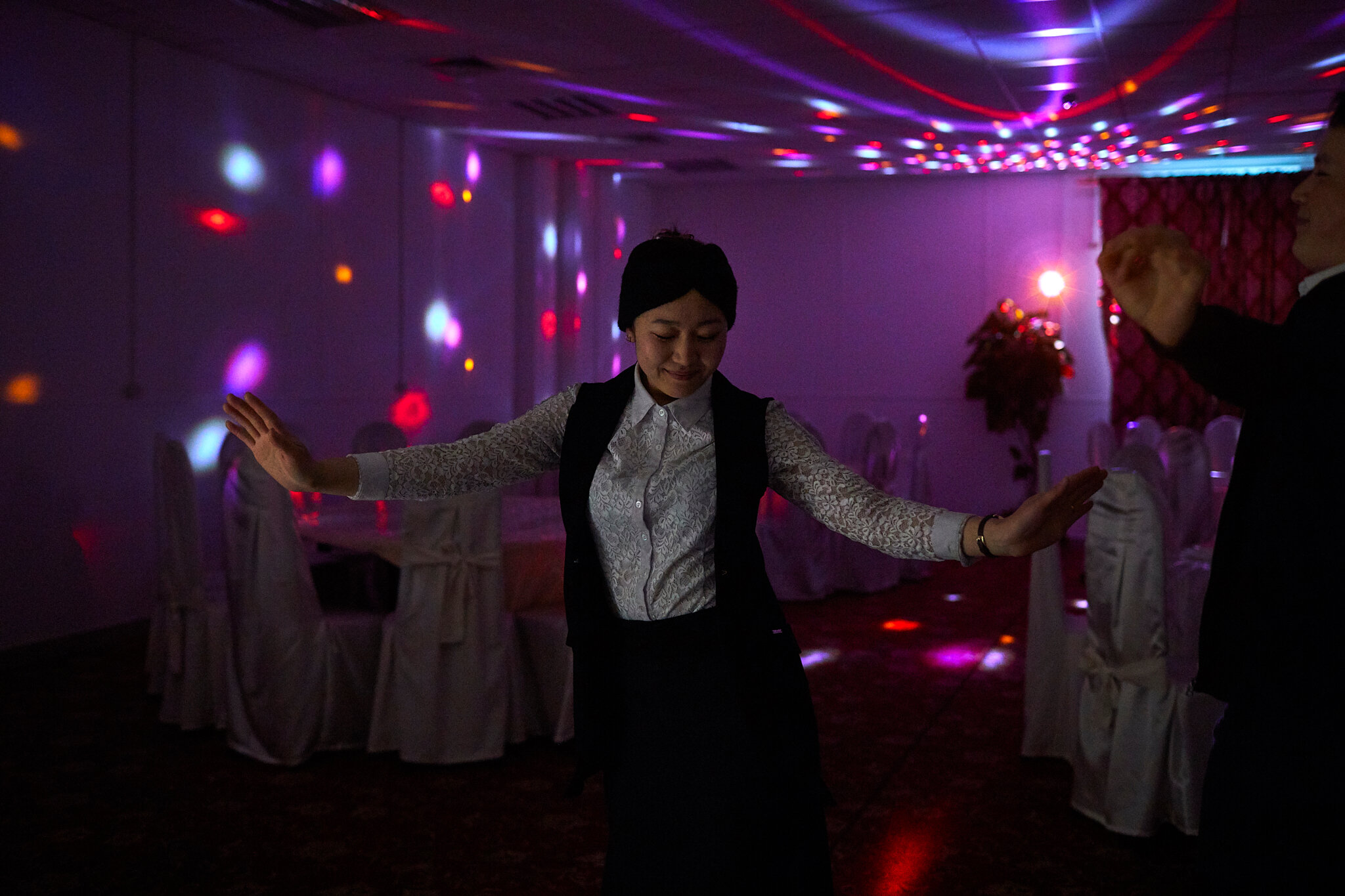 Russia, Moscow, chaikhana “Uzgen”, 11/10/2019. Tahmina K., 25, is dancing in the chaikhana (teahouse) “Uzgen” she is working at. The chaikhana “Uzgen” is open 24/7. The week was very busy and Tahmina slept at the cafe and hasn't been at home for a