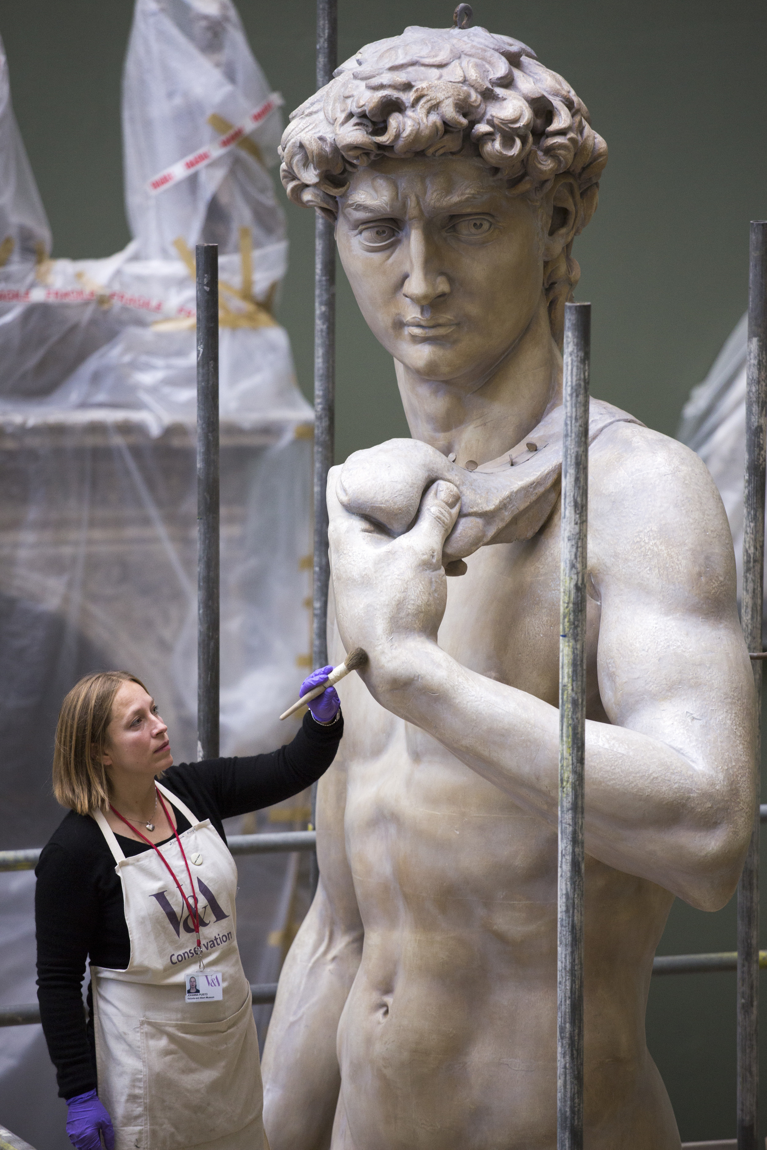  Sculpture conservator Johanna Puisto cleans the V&amp;A's cast of Michelangelo's David ahead of the reopening of the  Weston Cast Court , November 2014. 