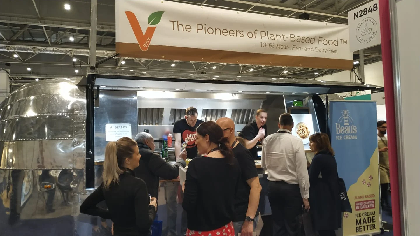 People line up to taste the delicious new foods.