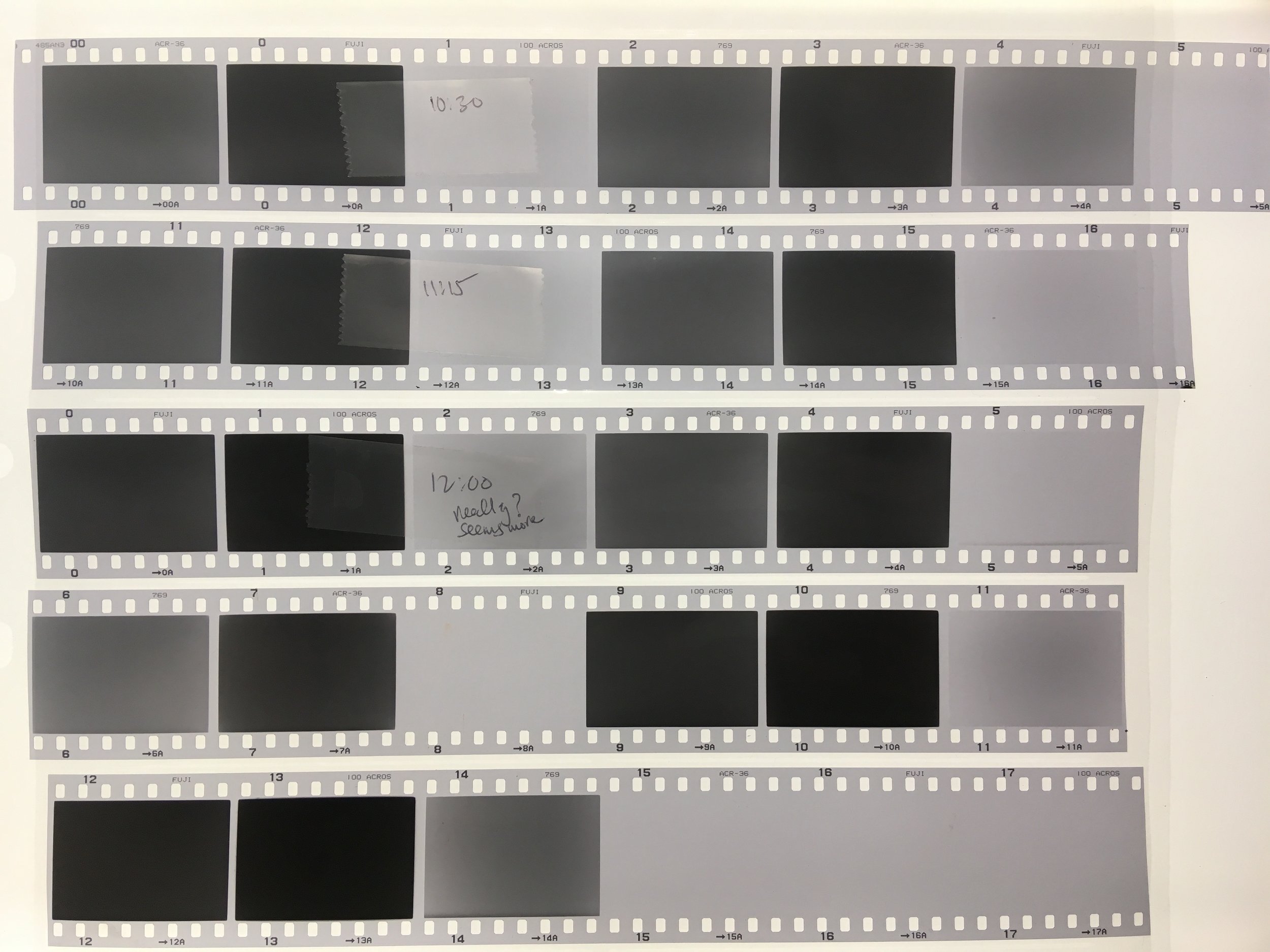 bracketed test roll exposed at different EI settings for N, +3, -4. We are looking for a set of the frames where the -4 exposure barely starts producing density on the film. The +3 exposure should be nearly black. Anything greyish here would mean underdevelopment and probably a low contrast final photo. 