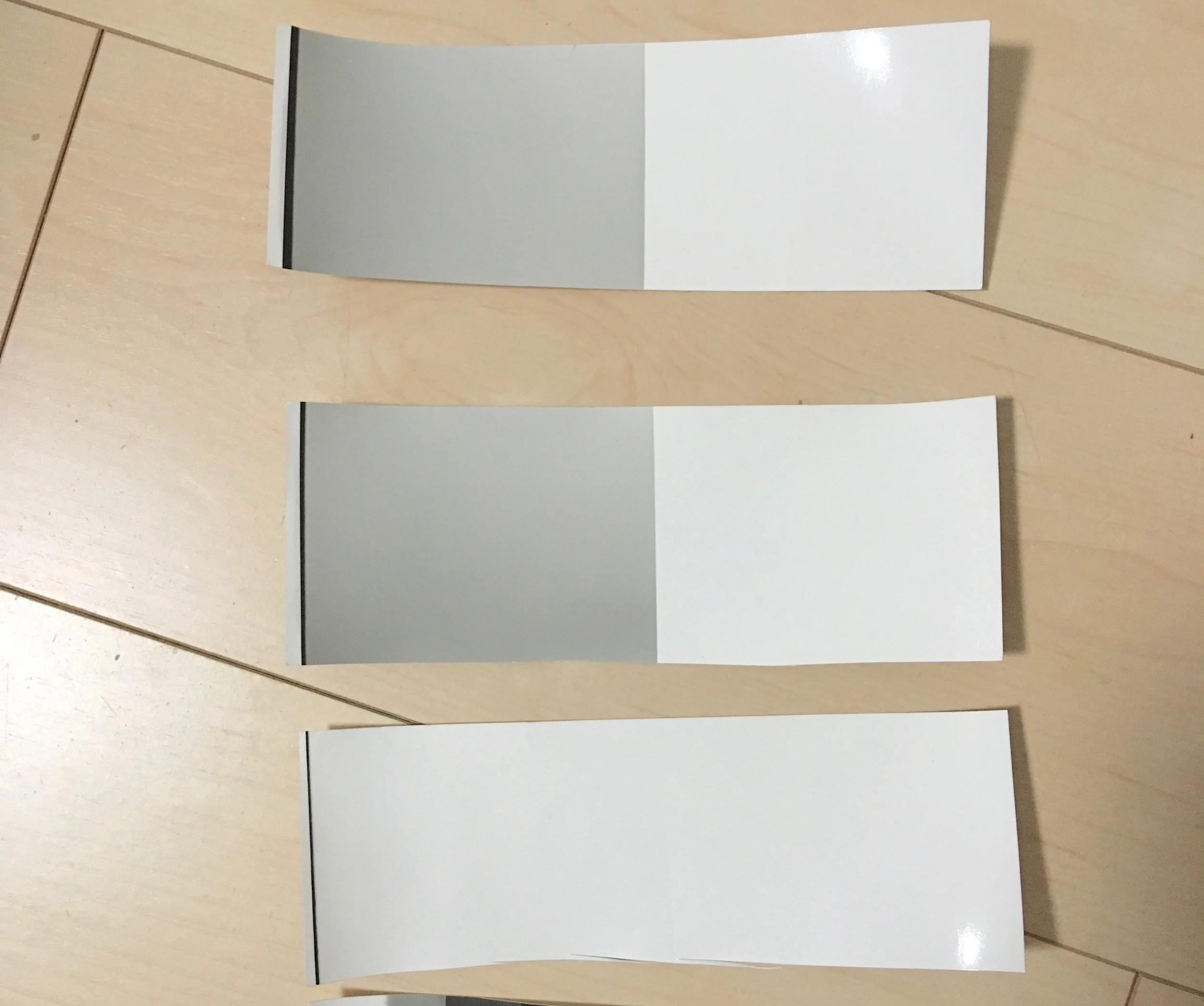 meter at 100 ISO, +3 stops over exposed frame enlarged onto paper to determine dev time. top: 11'15", center: 10'30", bottom 12'30". Here we are exposing the near black super dense negative onto paper. Right half is covered up completely and hence purest white the paper will produce. The left side is the dense negative at 12 seconds. This should be dense enough to barely produce any tone onto the paper. Just a shade away from white is what we are looking for. Anything darker here would mean low contrast final results. 