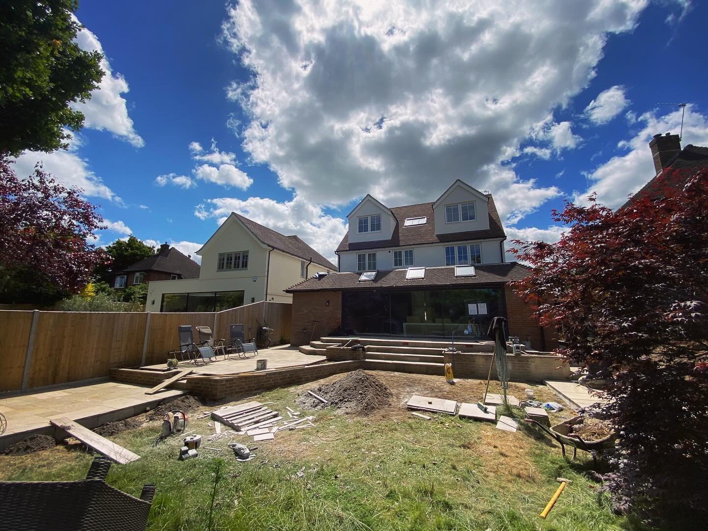 Progress visit at this residential #gardendesign project. A traditional style using Yorkstone reclaimed onsite to create patio tiers and raised planters on a sloping site.