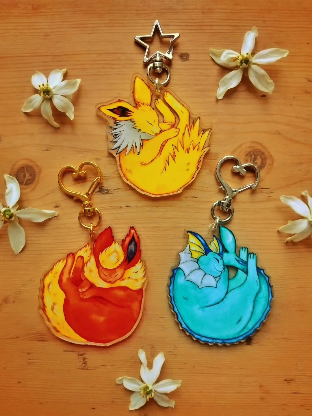Congratulations! Your eevee evolved into a shrimpeon 🍤 Recycled acrylic eeveelution charms available soon ✨️ 

(Thank you to @zapcreatives for helping me make them!)🥹