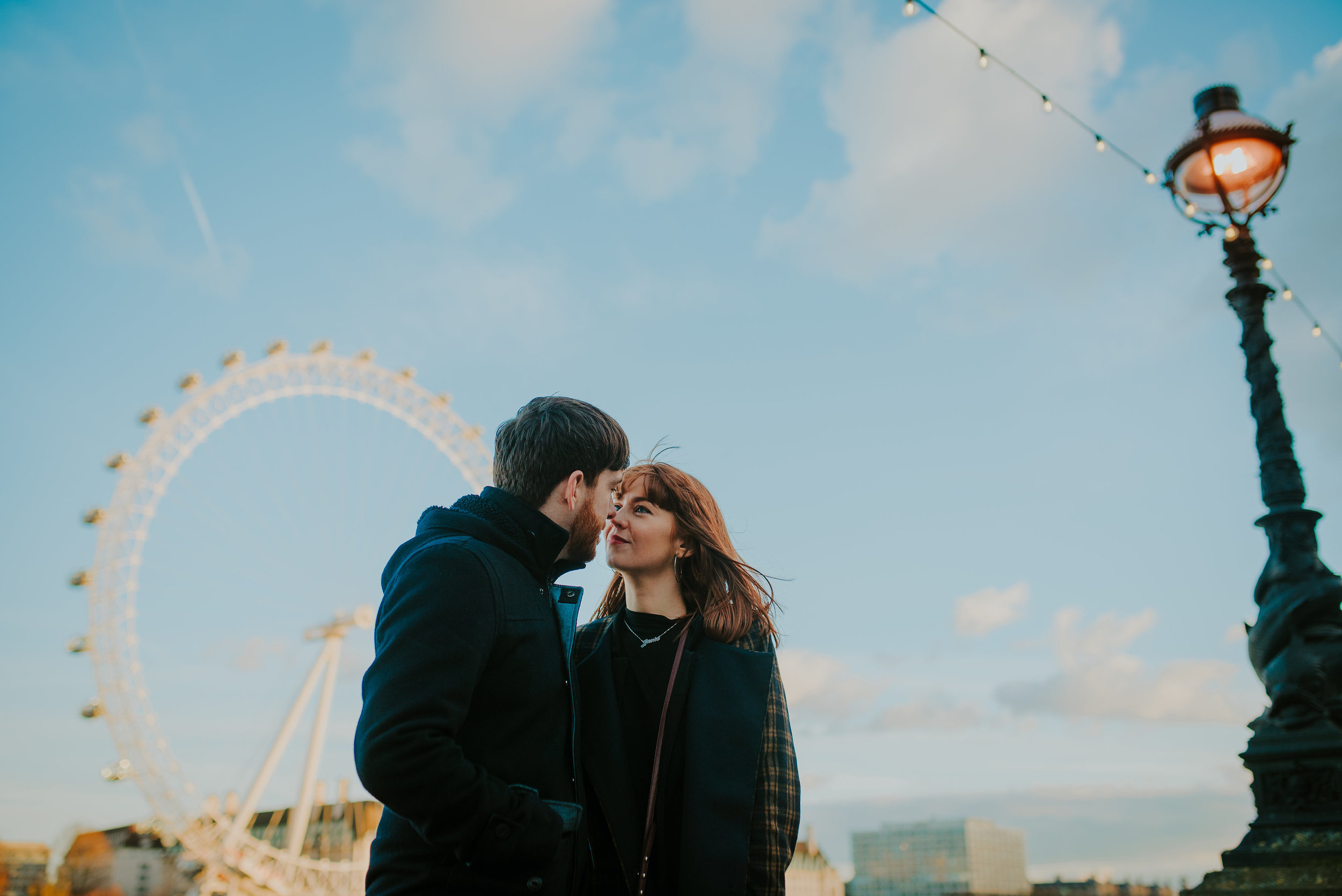 Couple in love in front of the London Eye