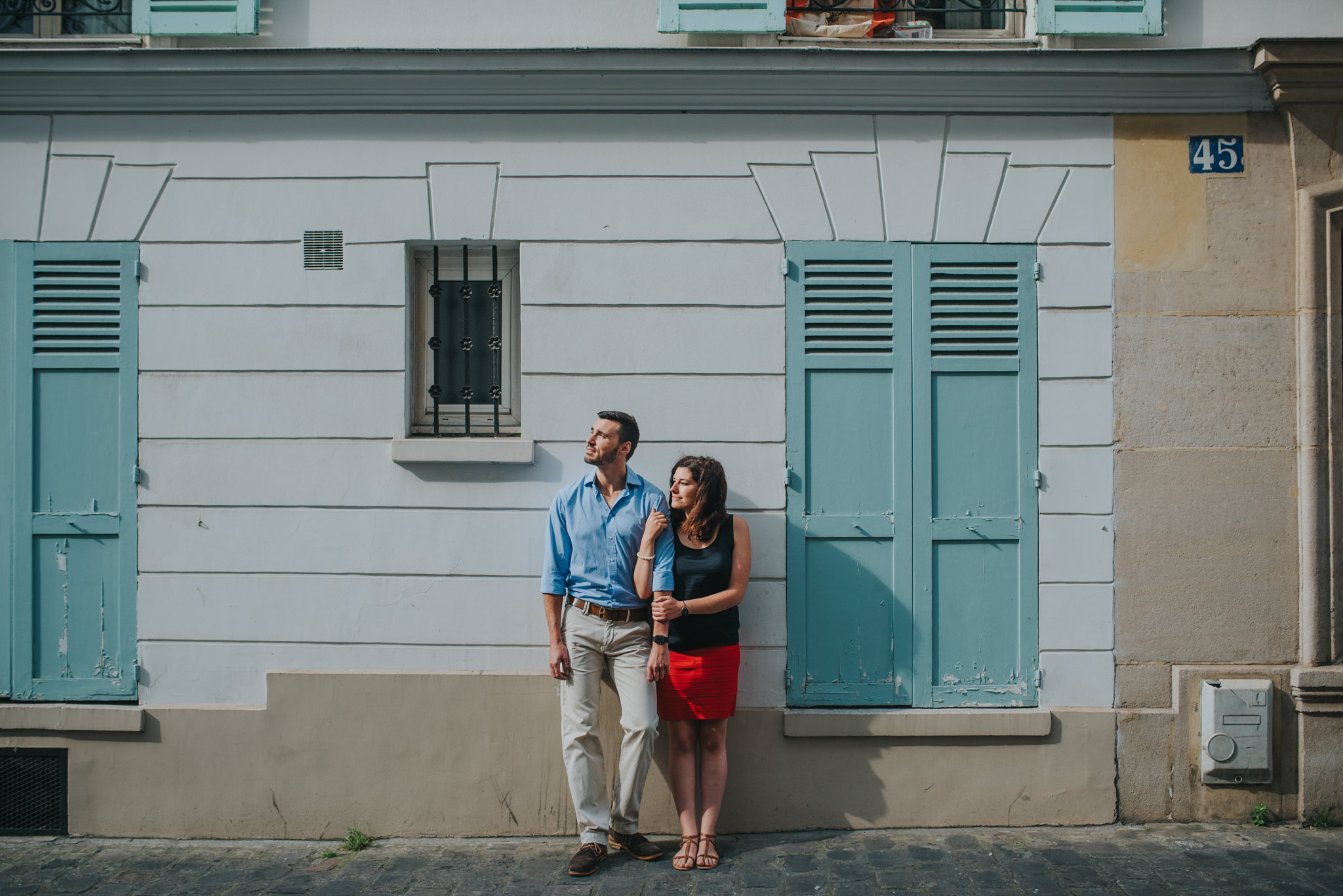 Engagement photoshoot couple in love holding hands on Montmartre street
