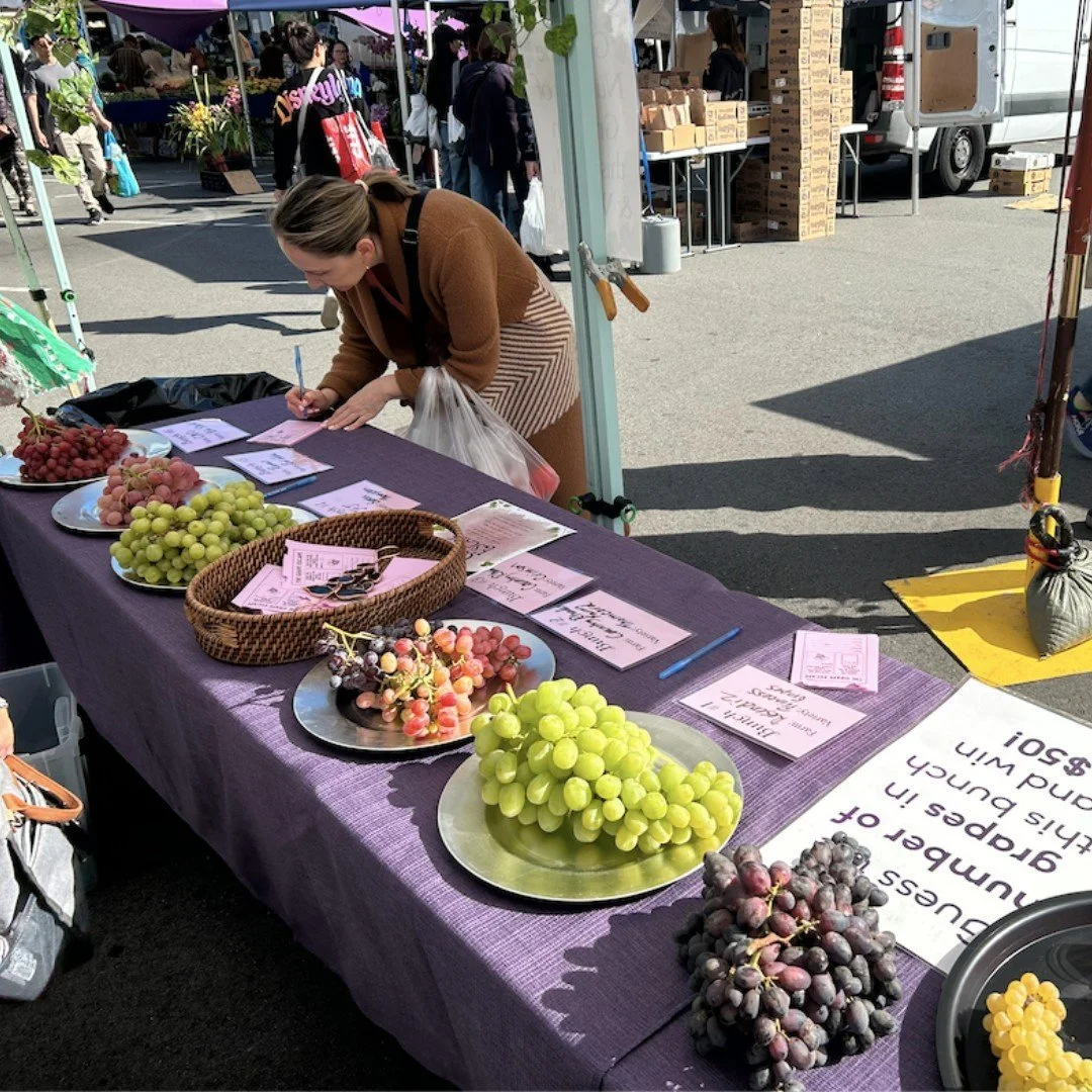We had a wonderful time at Grape Escape at the Daly City Farmers' Market last Thursday! Many bunches of grapes from the small farms at market were displayed for voting for the "Most Beautiful Bunch" of grapes. We also had a guess the num
