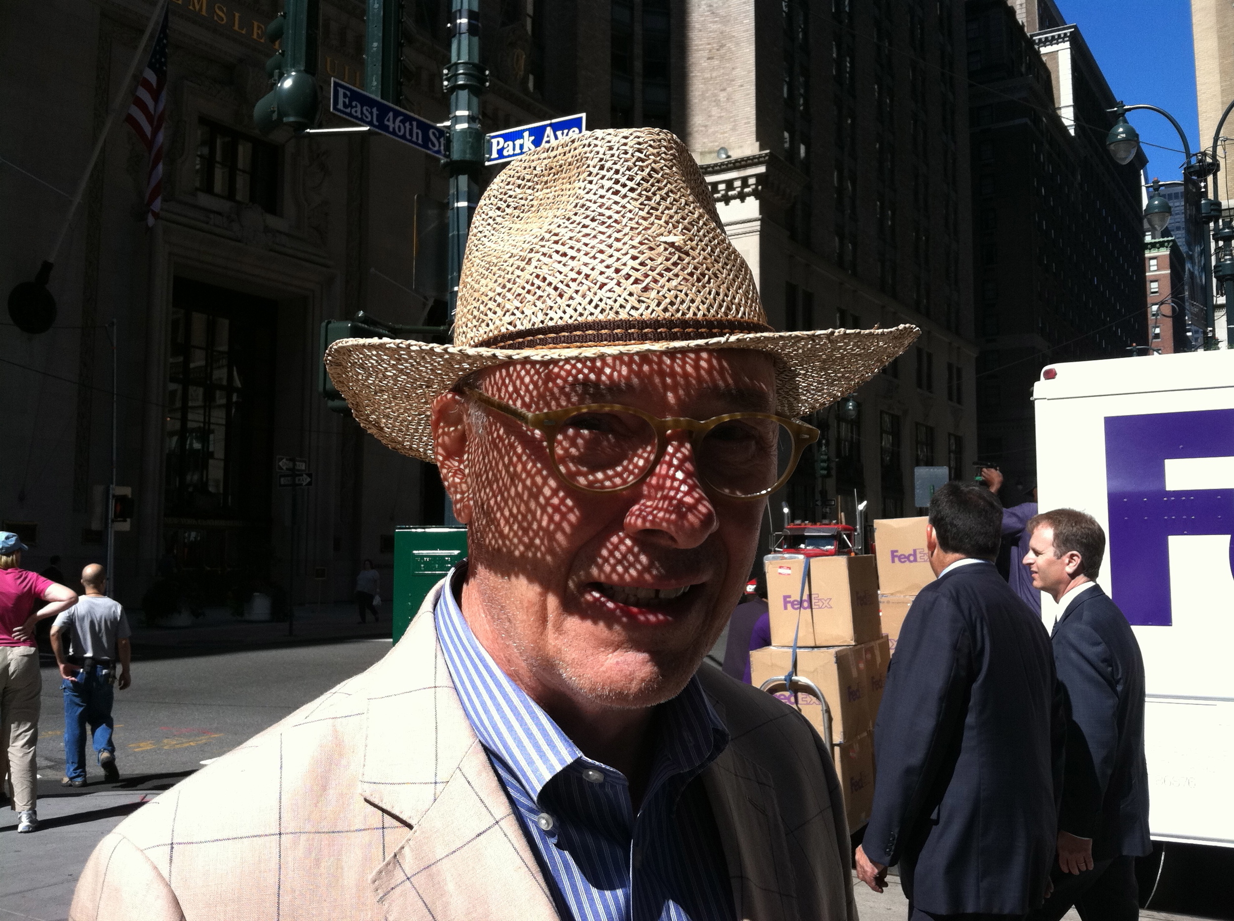 shadow falling on face through straw hat