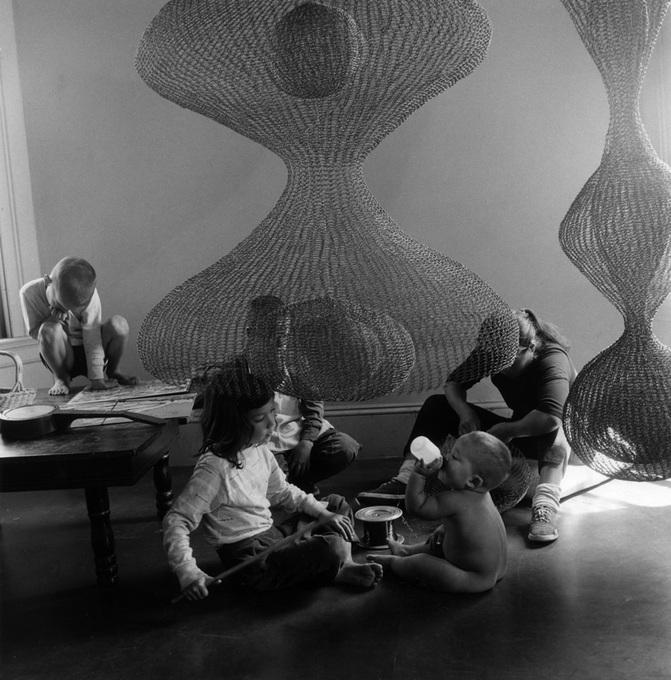 Ruth Asawa at work with her children