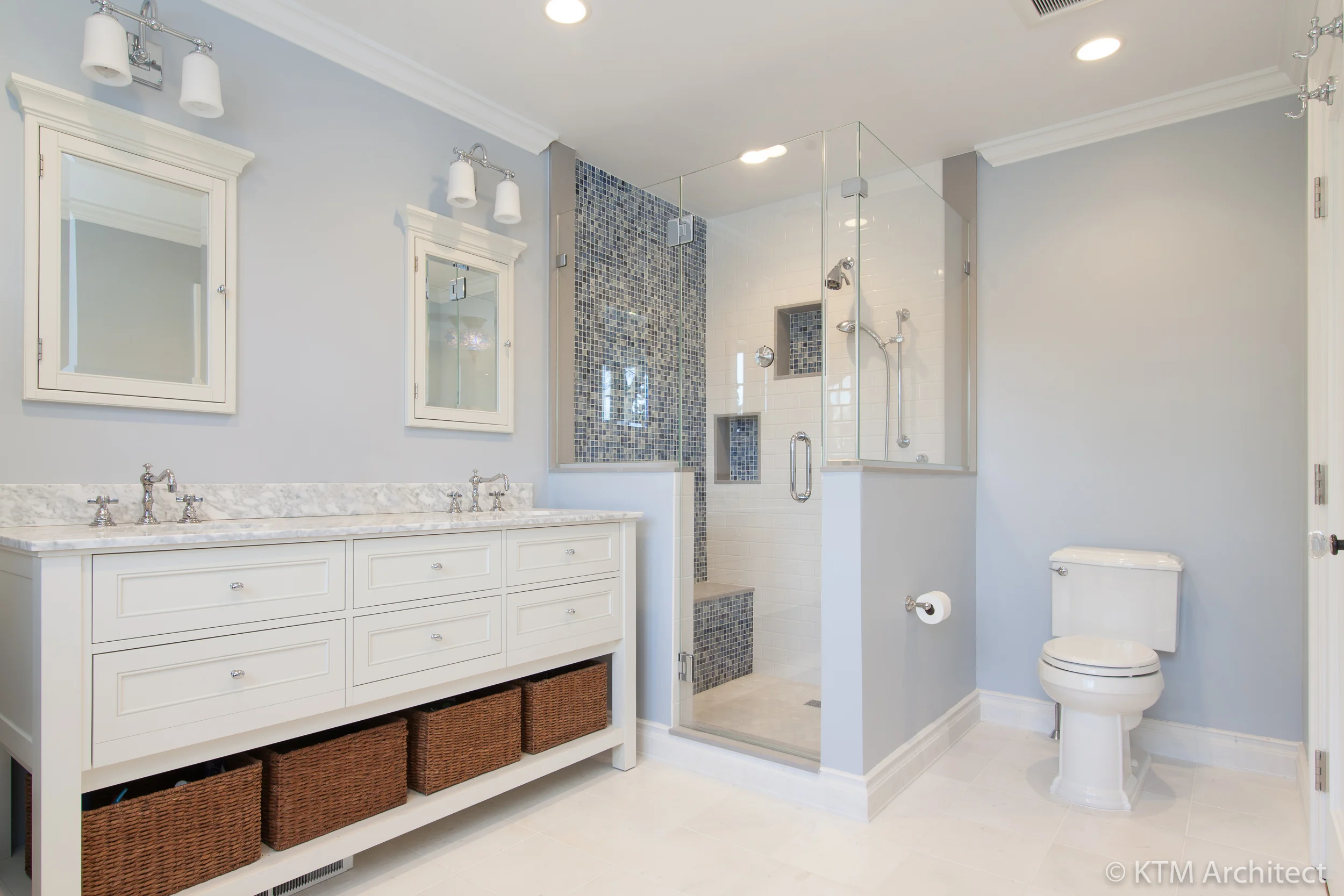 The addition allowed for an upstairs master bath. The vanity with open shelving brings a contemporary edge while the fixtures and classic marble and white combo are a nod to the traditional.