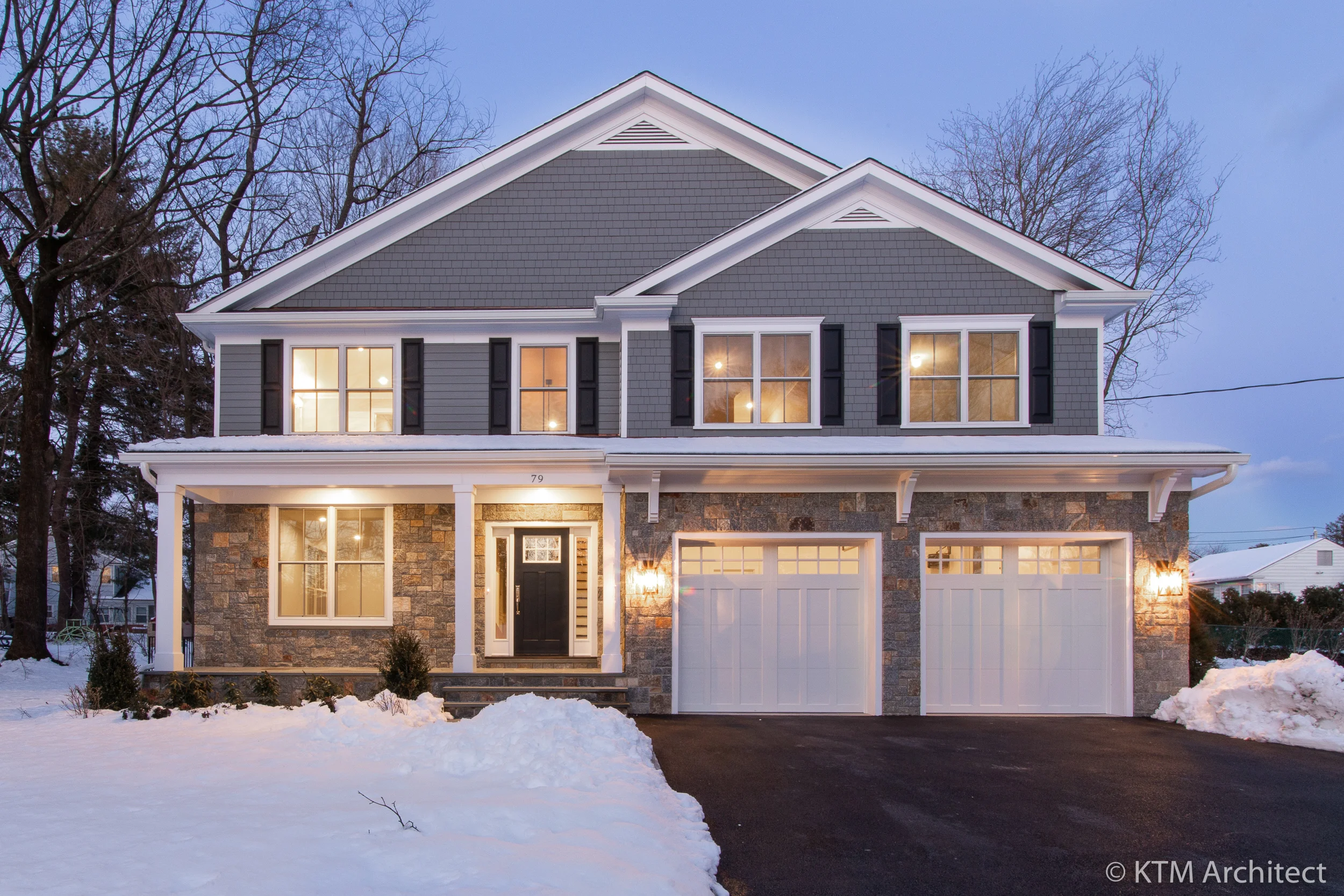 The quality of the construction is evident throughout, inside and out. The well-proportioned two-story home has a welcoming porch, large windows, and a double garage.
