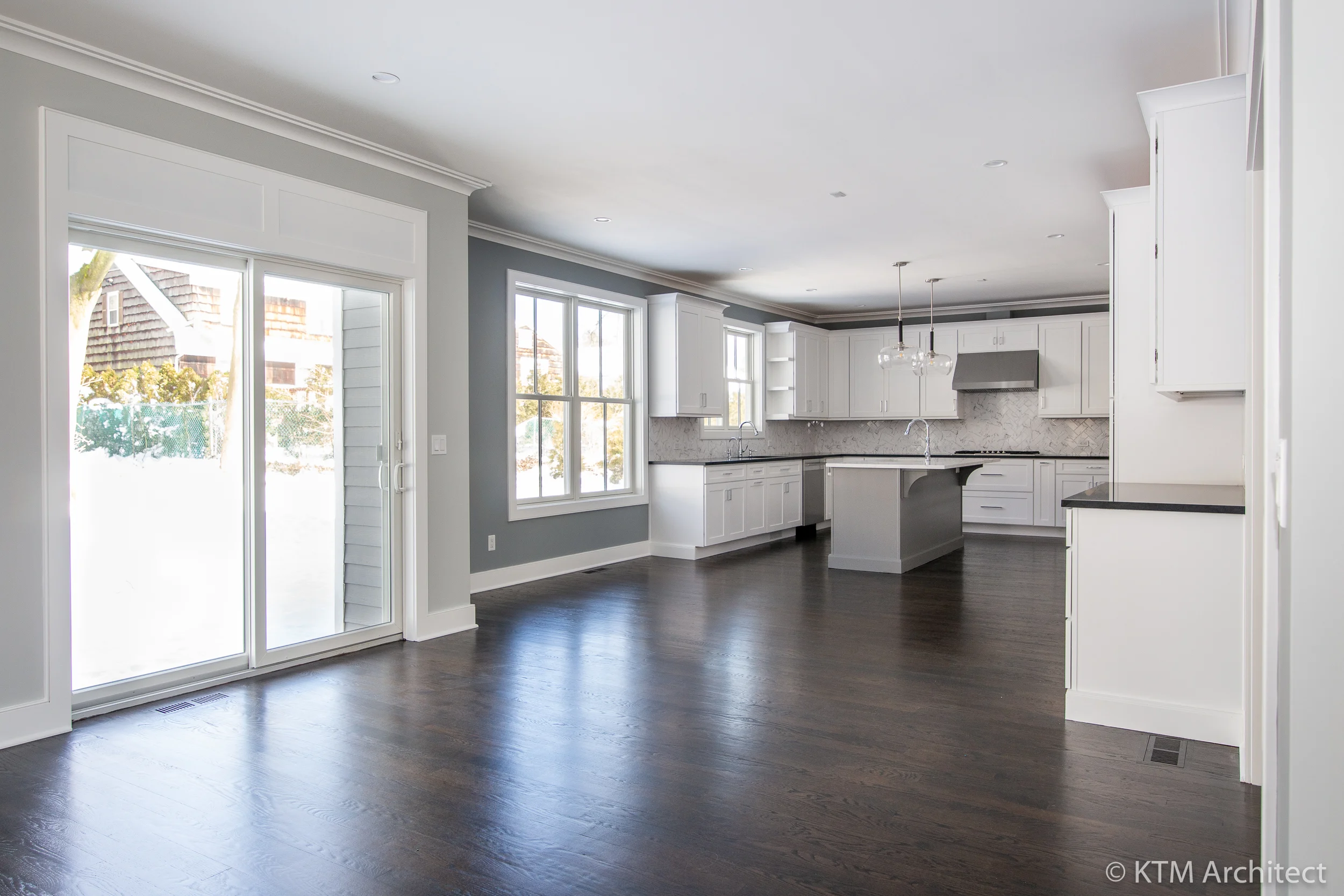Large sliders provide access to the back patio and yard.