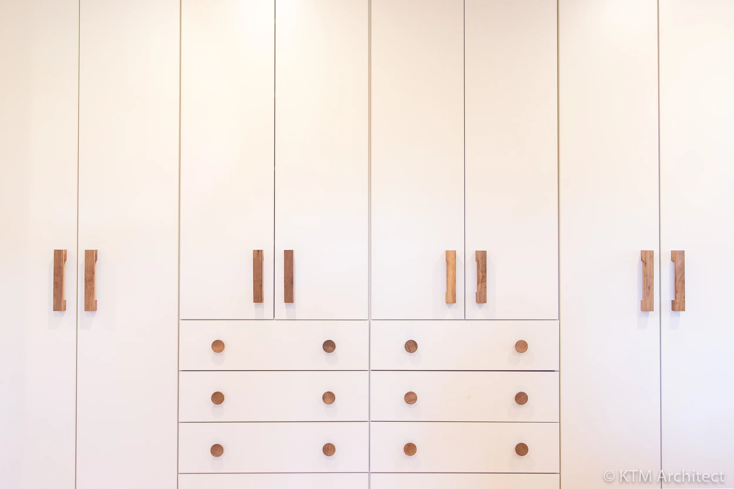 The tactile wooden handles and simple symmetry of the design have an Asian influence with a modern edge.