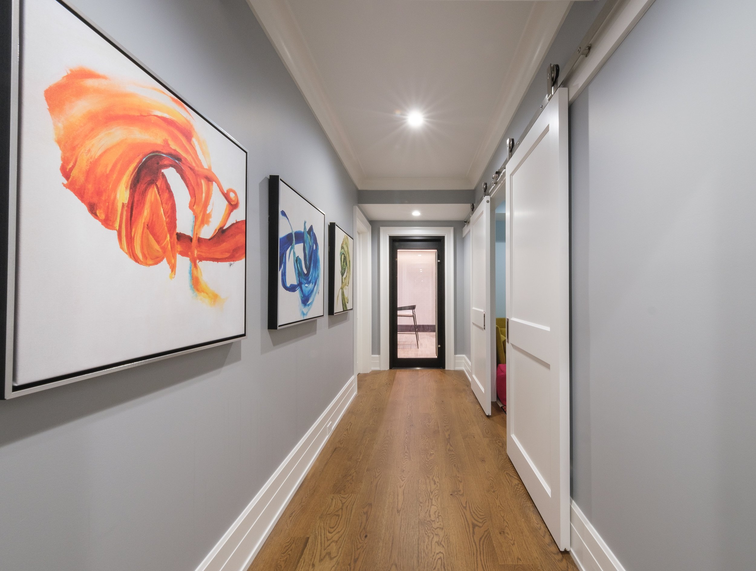Greenwich CT basement remodel. Hallway leading to playroom, theater room and bar.