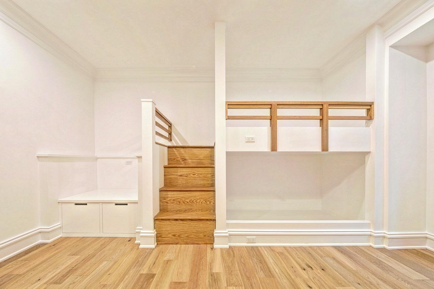 Custom bunk bed wall features bench seating above pull out cubbies on left as well as a beautiful stair leading to the top bunk. A compact but extremely functional layout. #kidsroom #guestroom #bunkroom #bunkbeds #custom #build #craft #transitionalde