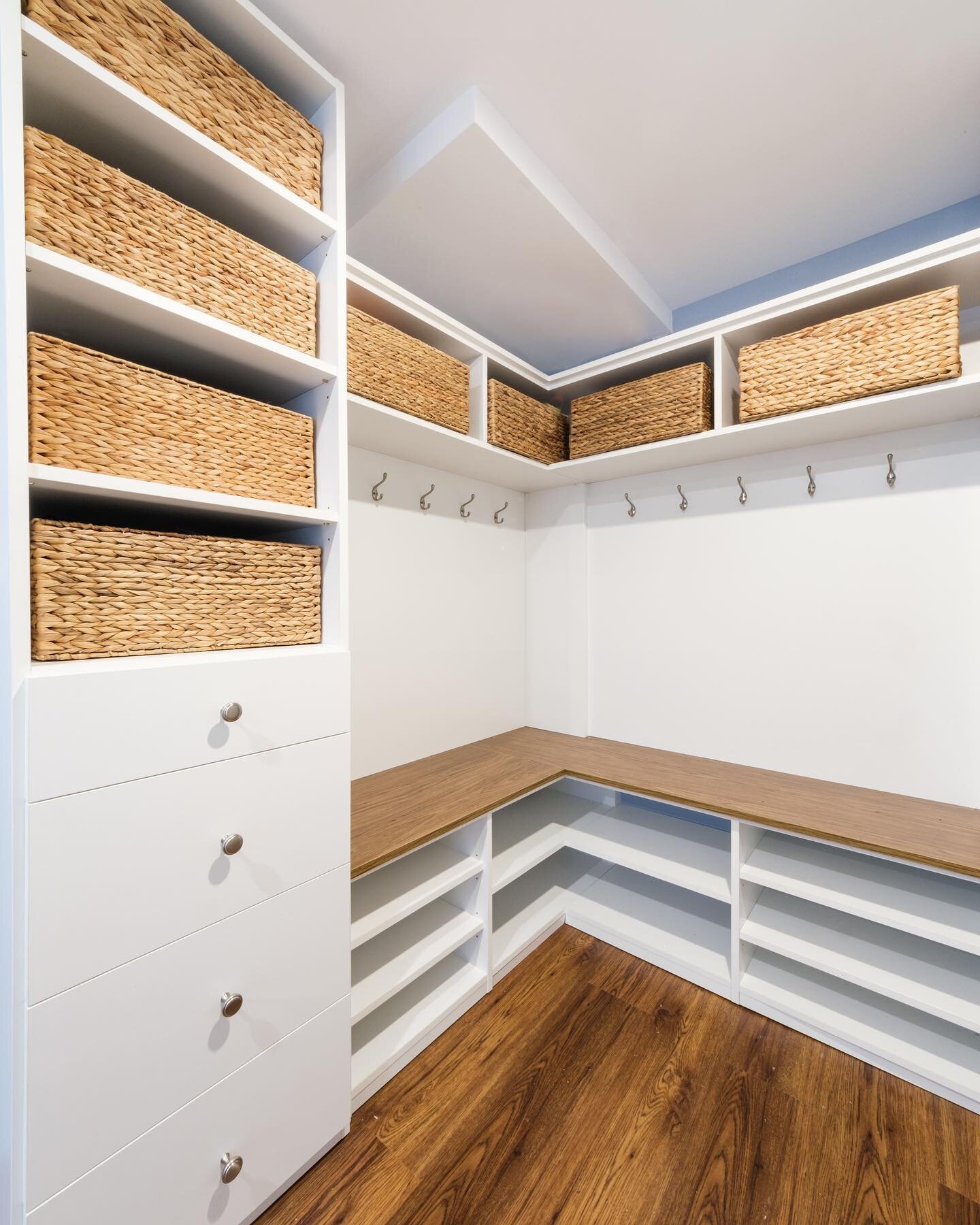 The corner of this combination mudroom-laundry room offers plenty of storage on a compact space. Adjacent to the garage it is a perfectly tucked away space to leave the day&rsquo;s gear.  The builtin seating provides a functional space for removing b