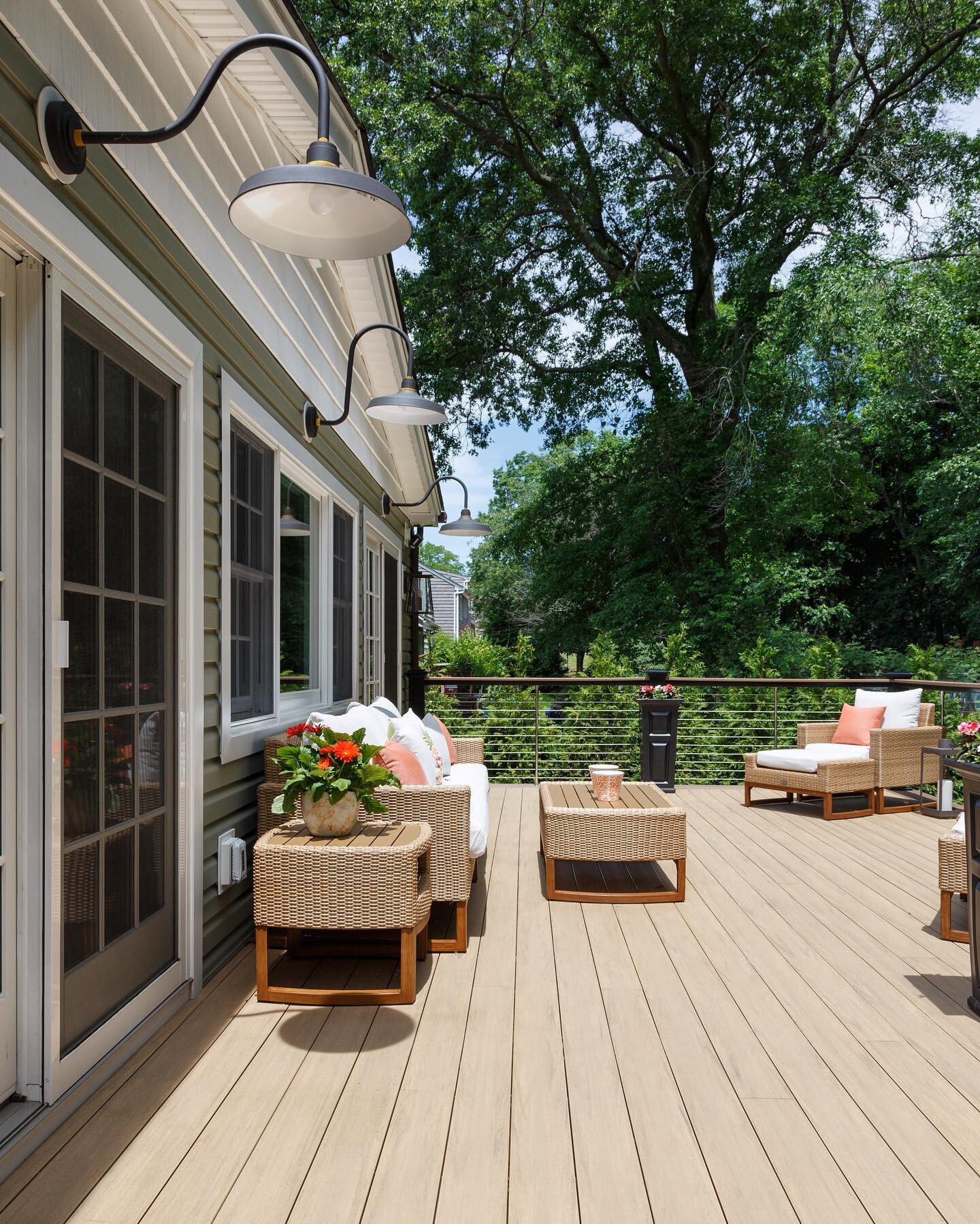 Ready for Spring: this deck connects to the kitchen and great room of the home, making entertaining a breeze. The sculptural lighting provides light where needed while minimizing light pollution #deck #lighting #outdoorliving @mjscontractingcorp phot
