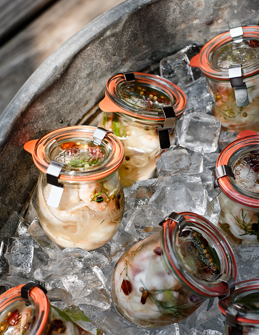 Pickled foods in jars over ice