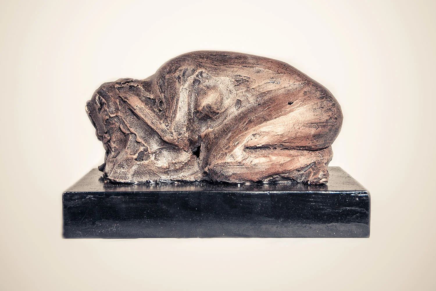 woman-crouching-bronze-color-clay-sclupture.jpg