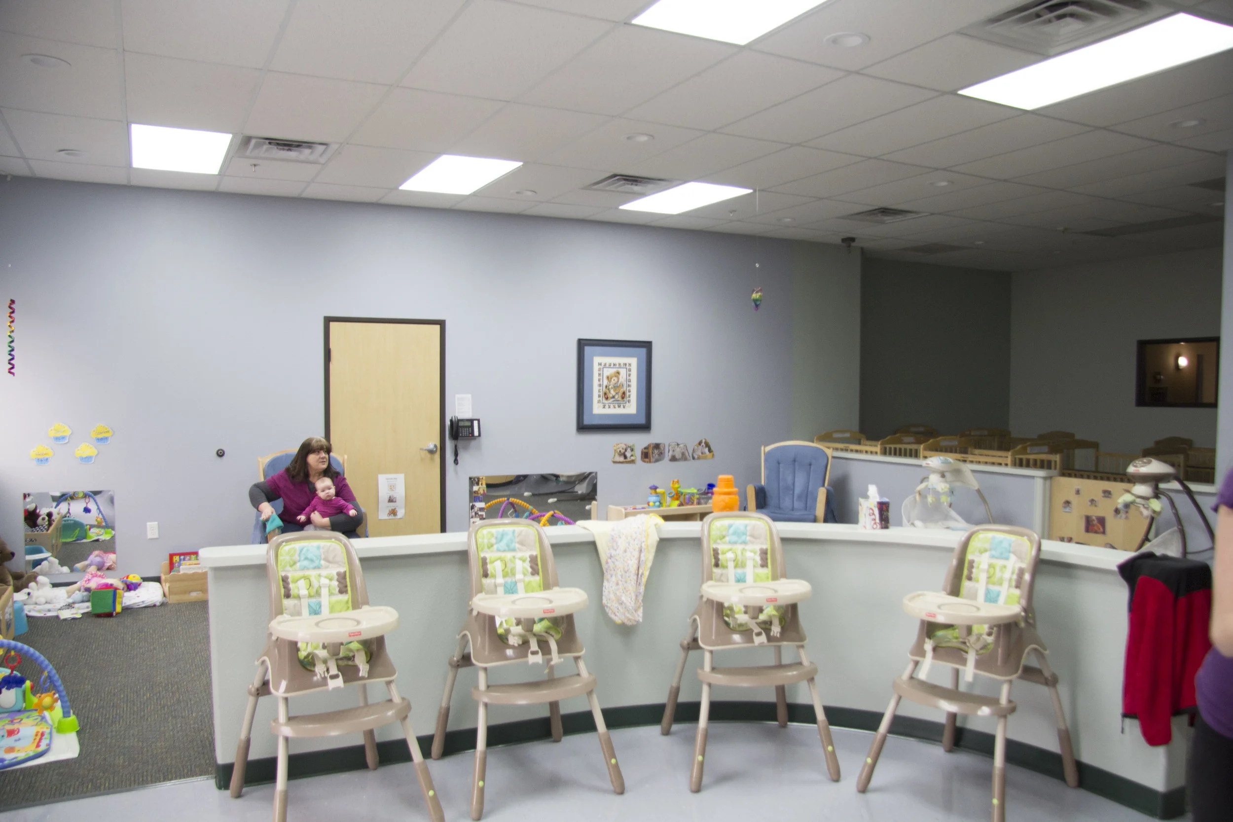 the tlc nursery has an open play area, a full kitchen with breast milk storage abilities, and a separate crib area. all visitors are asked to remove their shoes before entering the nursery.