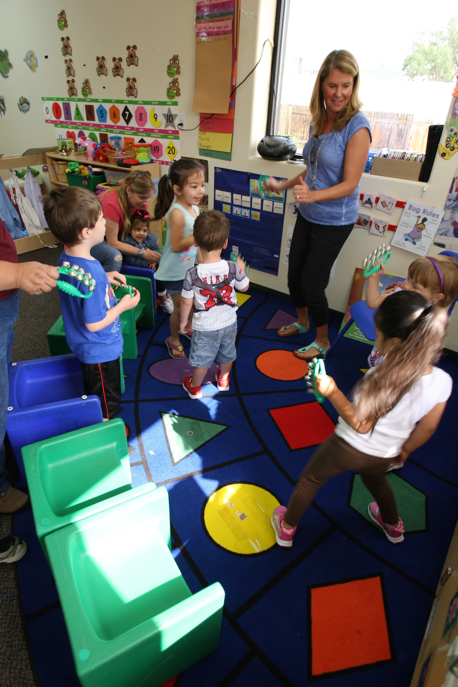 TLC preschool students enjoy interacting with their teacher after reading a story together