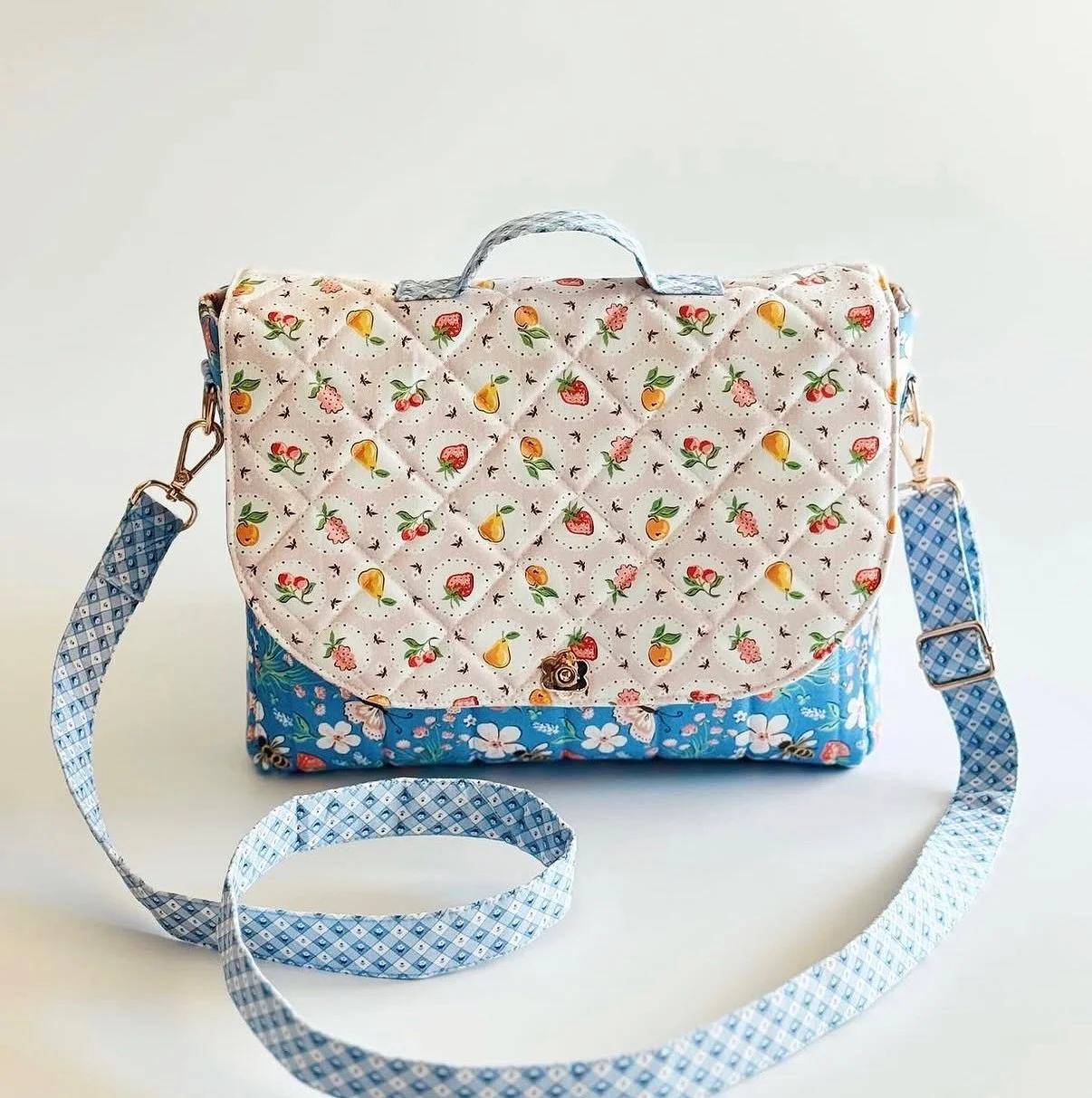 The Rambler Bag&mdash; Have you made one yet?
.
This messenger-style bag is sure to become a wardrobe staple! It&rsquo;s the perfect size for everyday life and features a large flap secured by a pretty flower-shaped magnetic snap, as well as an inner