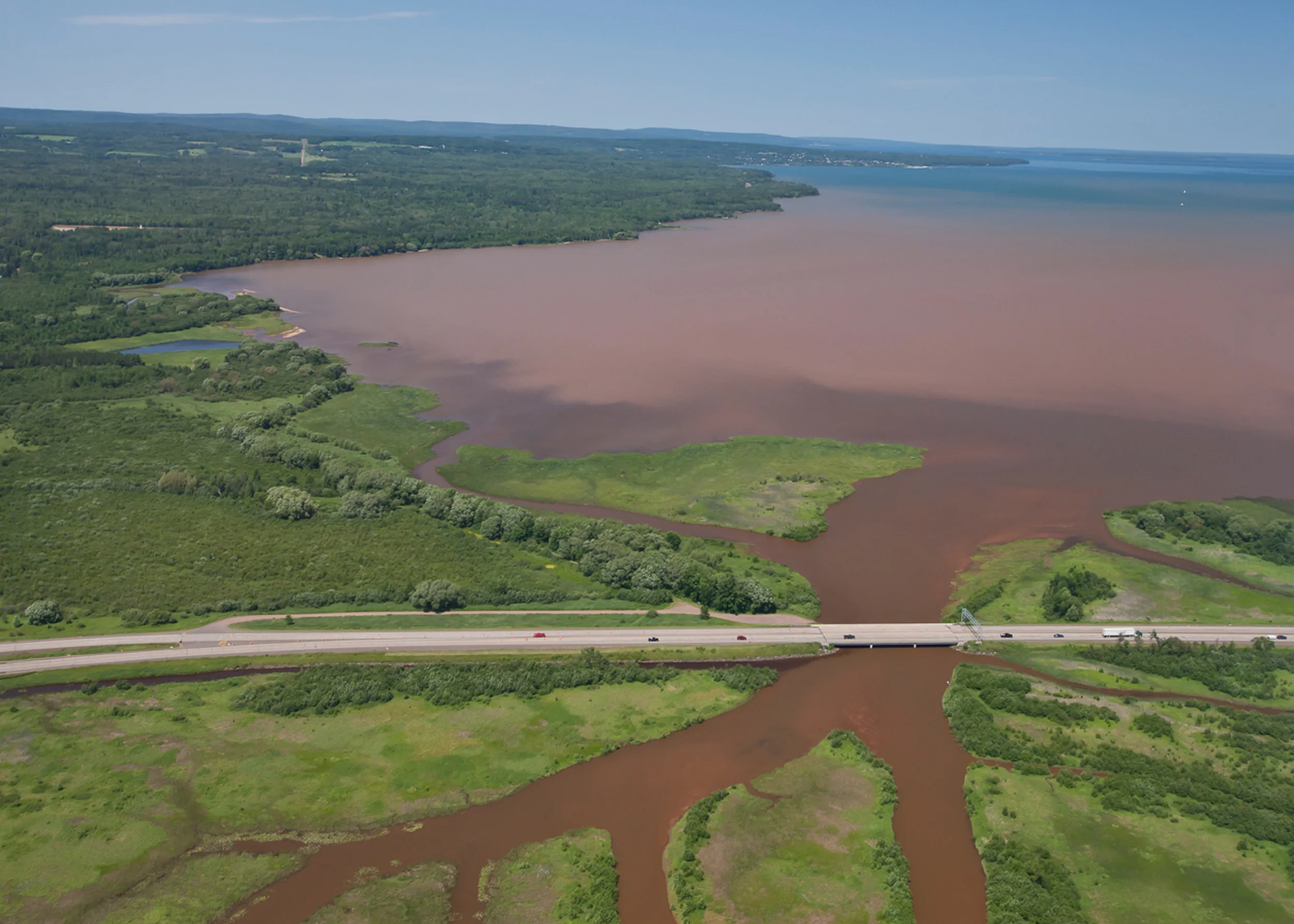 Fish Creek emptying sediment and run-off from farms and residences upstream into the Chequamegon Bay in Lake Superior after a heavy rain in 2013.