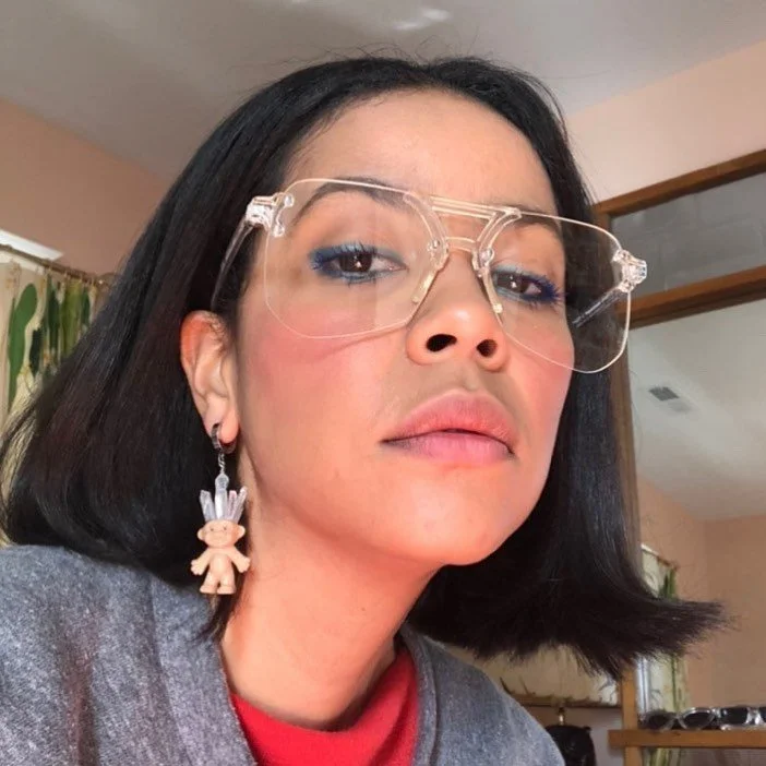 @oldsoulsvintage looking glam in her troll earring