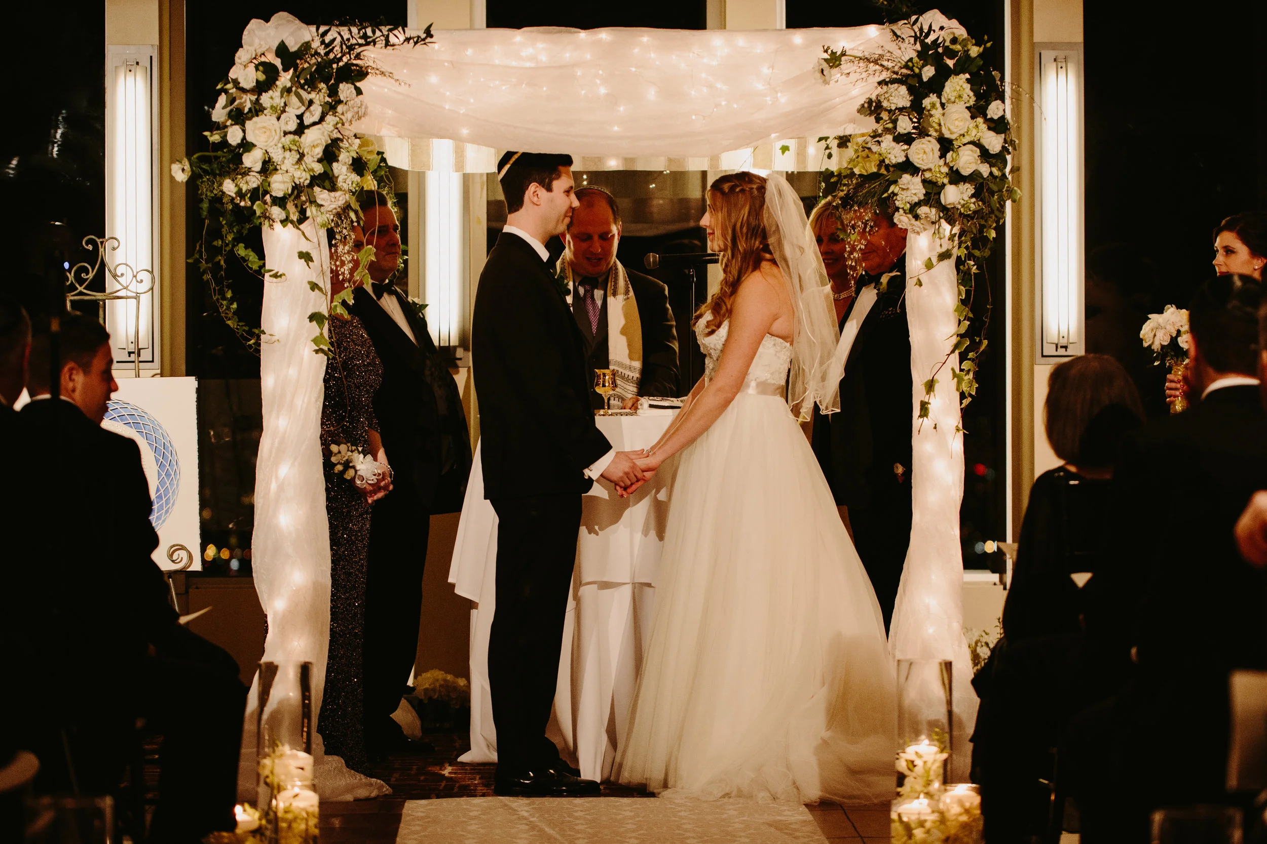Chuppah - Fabric Pole Chuppah with Medium Flowers, String Lights Throughout, and Medium Fabric (1,350)