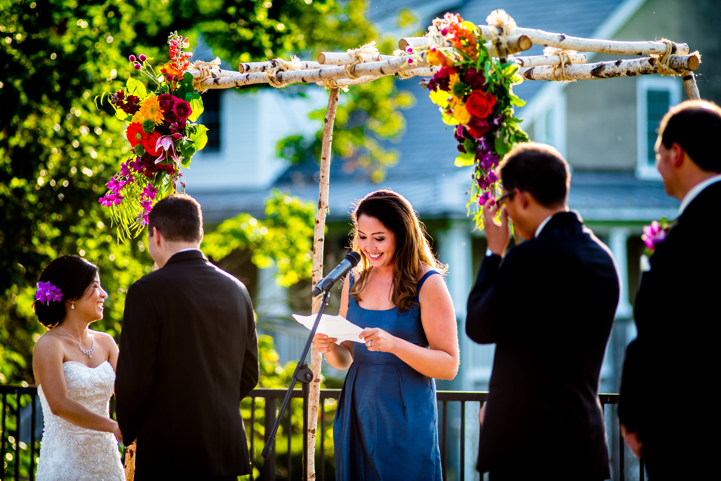 Birch Arch with 2 bouquets in the corners.jpg