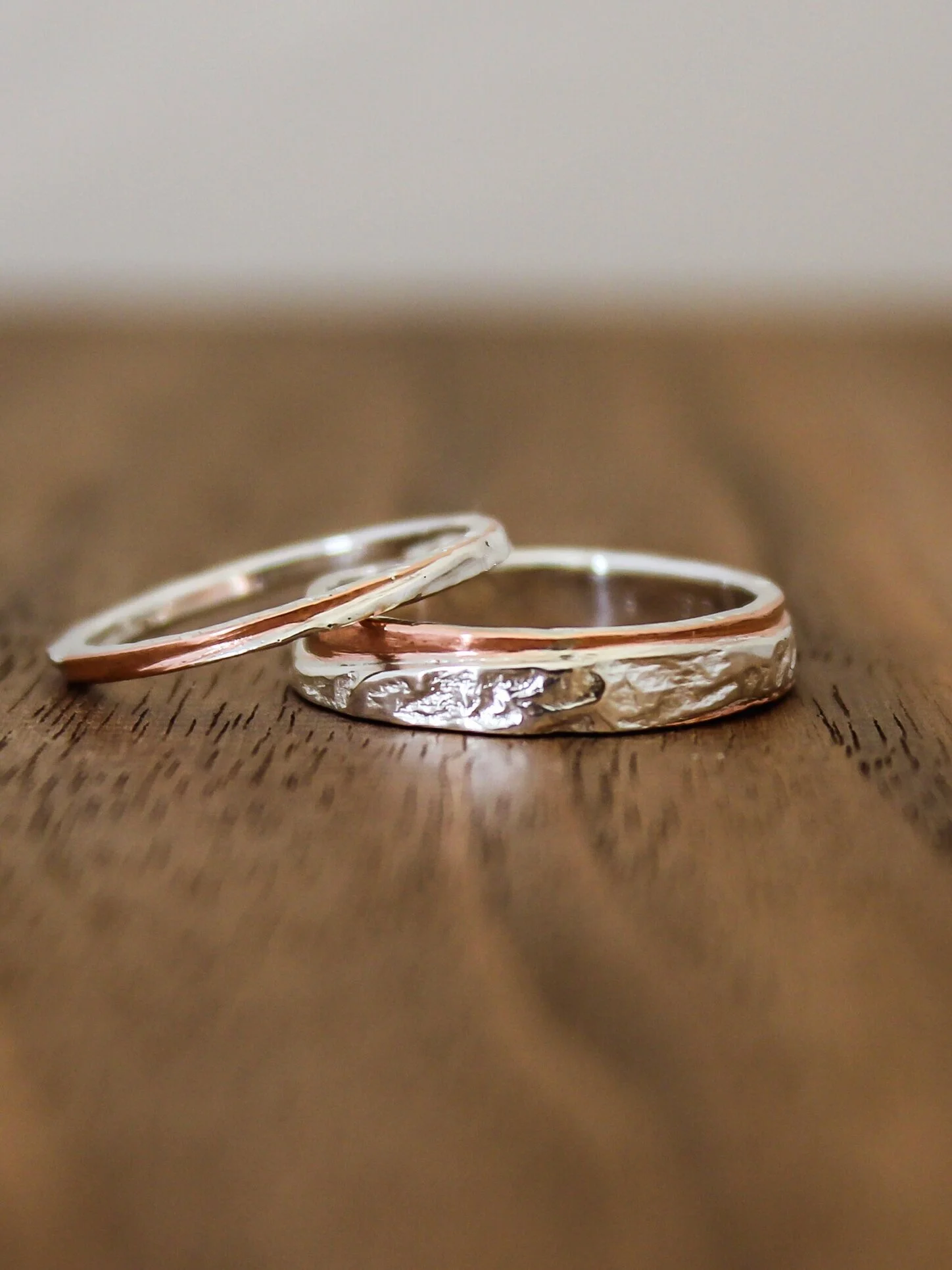  Made for a pair of good friends who wanted wedding bands that merged silver and copper. After some sketches, we settle on proportions and the use of reticulated silver to add a level texture and unperdiblity to the rings. Rings have a silver core wi