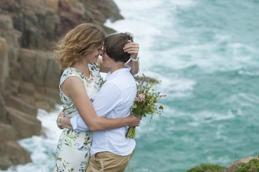 Copy of same sex wedding kiss on cliff top