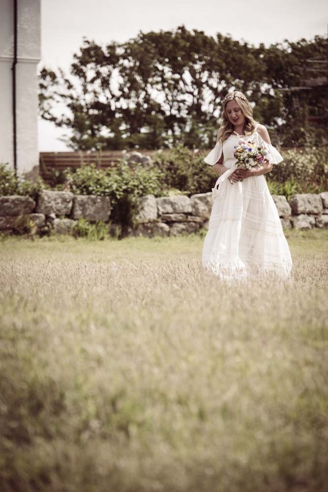 Bride crosses Lawn at Boho Cornwall.jpg