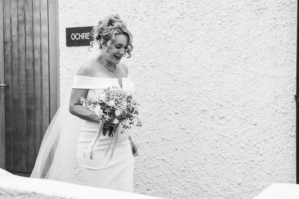 Bride leaves apartment at Boho Cornwall