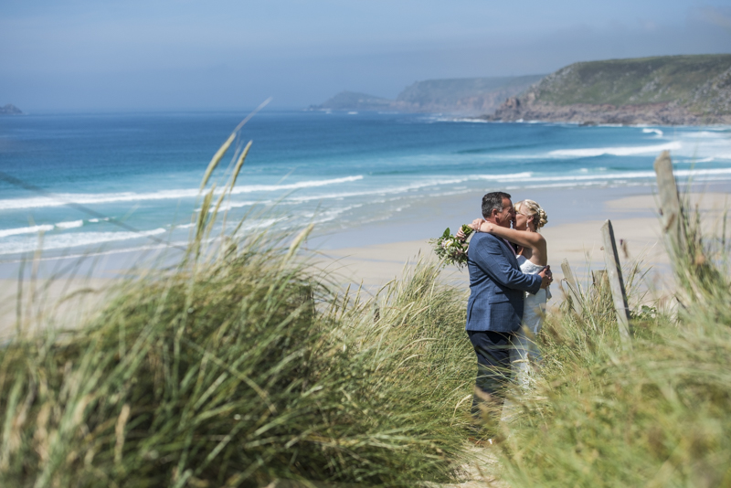 Kissing on the beach at Sennen cove Boho Cornwall