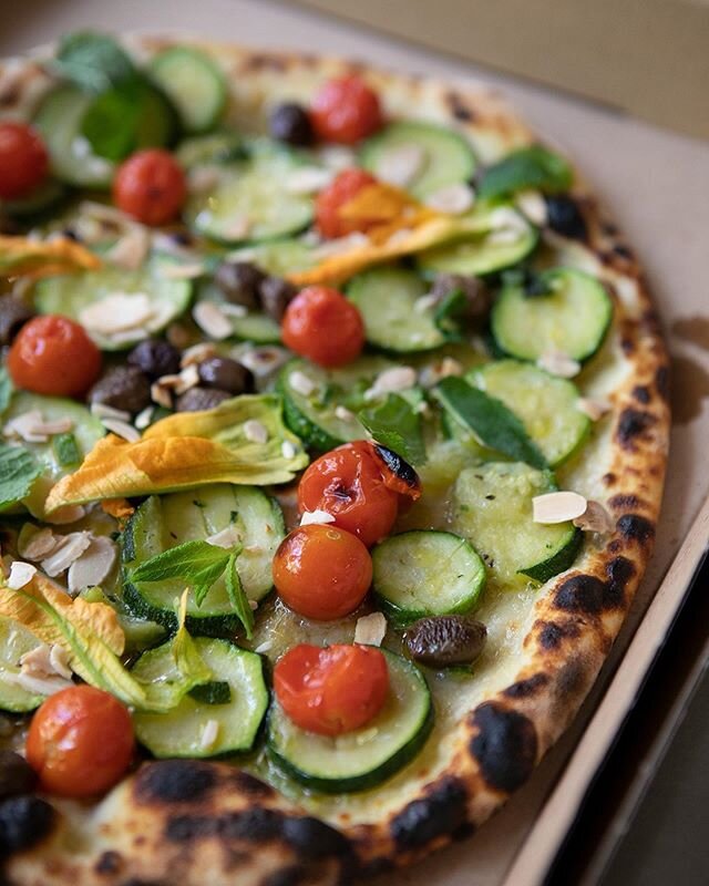 The vegan pizza everyone with tastebuds can get behind. Our slow cooked courgette, cherry tomato, black olive, flaked almond, tarragon &amp; zucchini blossom pizza is, to put it mildly, absolutely delicious. Local delivery and click and collect avail