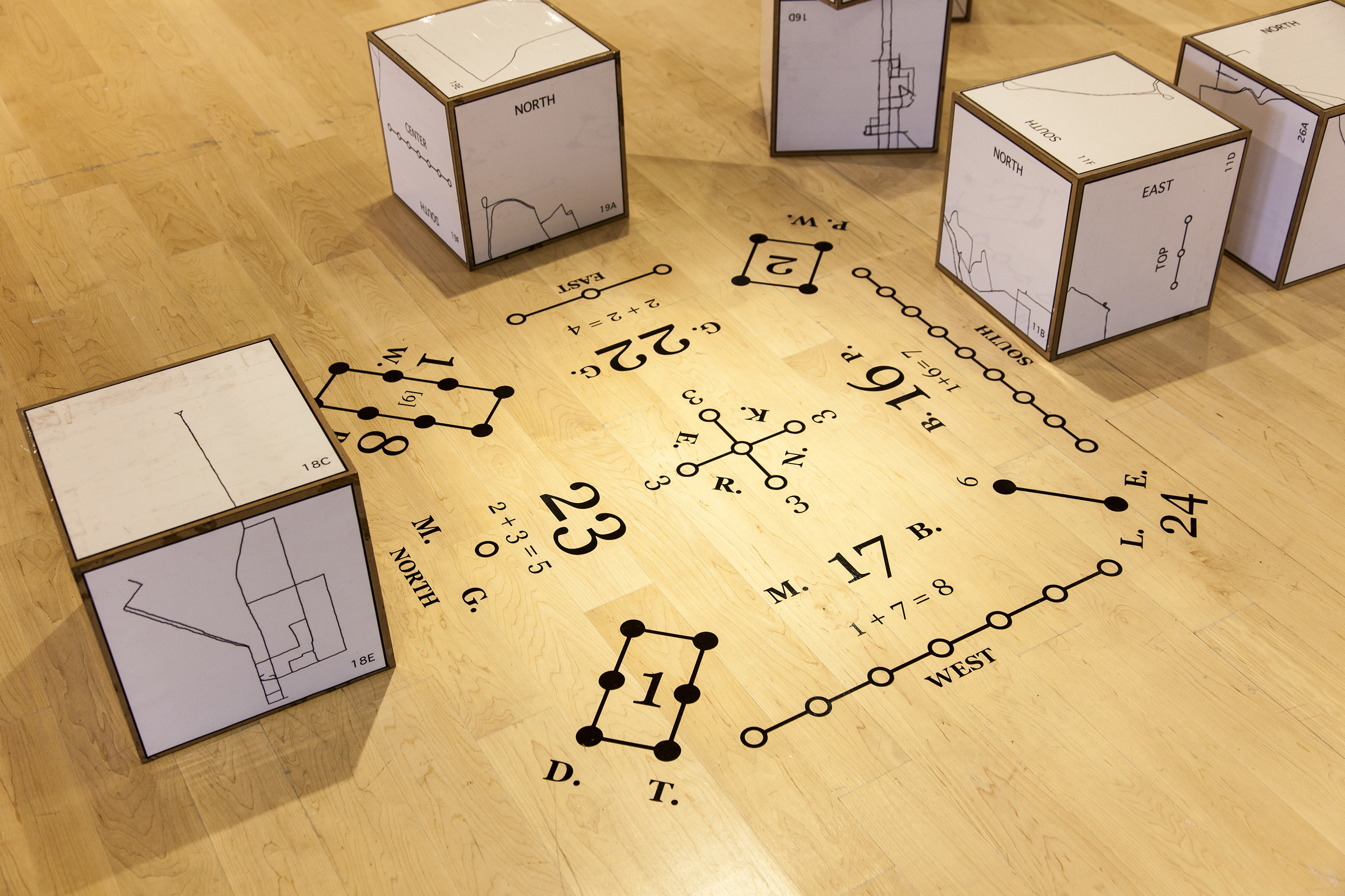   Inspired by magic cubes, Hoylman chose to represent each participant with a cube and number. Each cube was stacked in a certain order to create a perfect cube, representing the interconnection of people in the neighborhood.  