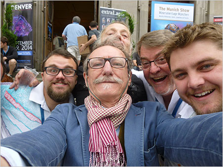 Sainte-Marie selfie. From left, Will Larson, Giancarlo Parodi (Muséum national d'Histoire naturelle), unknown (in back), Bill Larson and Carl Larson. Taken at the Sainte-Marie show last summer.