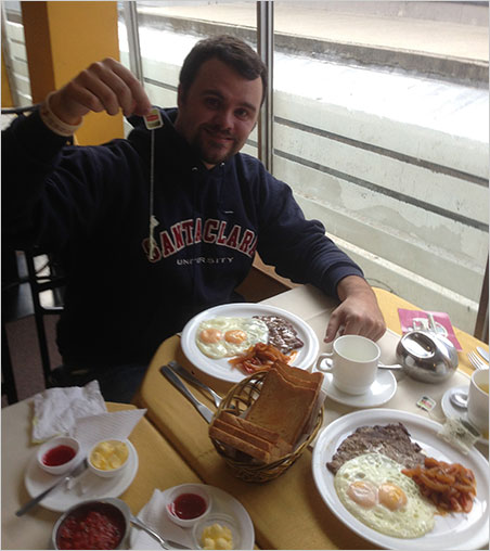 Tea party. After a long flight, Will Larson enjoys an Bolivian breakfast in La Paz. (Photo: Paparazzo)