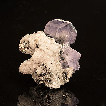 Fluorapatite on calcite with a dusting of pyrite. From Portugal, Inv. #21482 . (Photo: Mia Dixon)