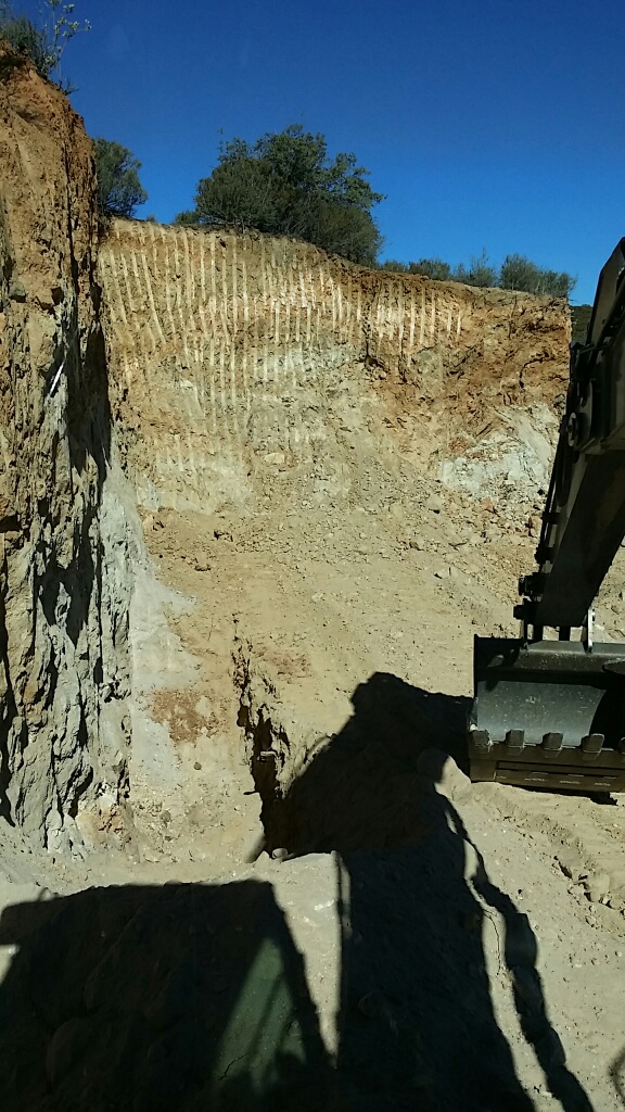 The Deere scrapes the pegmatite wall. Late September 2014. Click to enlarge. (Photo: Casey Jones) 