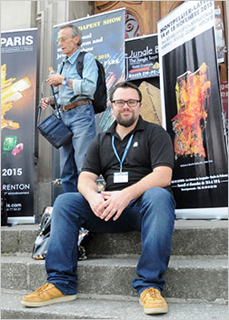 Will Larson sits on the steps of the theater. See what's on the other side of the door behind him. (Photo: Rika Larson)