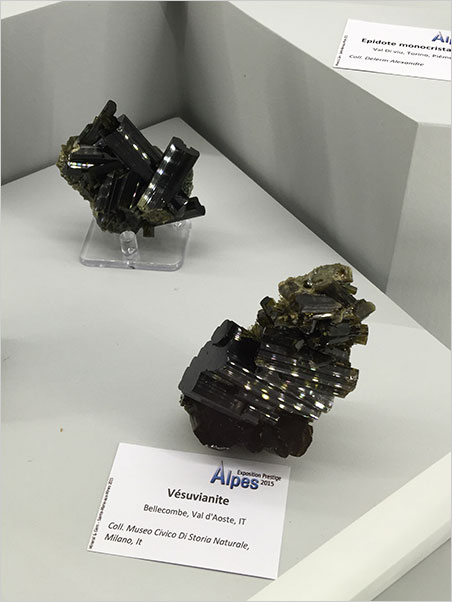 Alpine views. Display pinlights polka-dot the Caligari-esque stairsteps and jumble of olive-black vesuvianite specimens found on the Italian side of the Rhône-Alpes. From the special exhibition, Alps, at this year's Sainte-Marie show. (Photo: Will Larson)